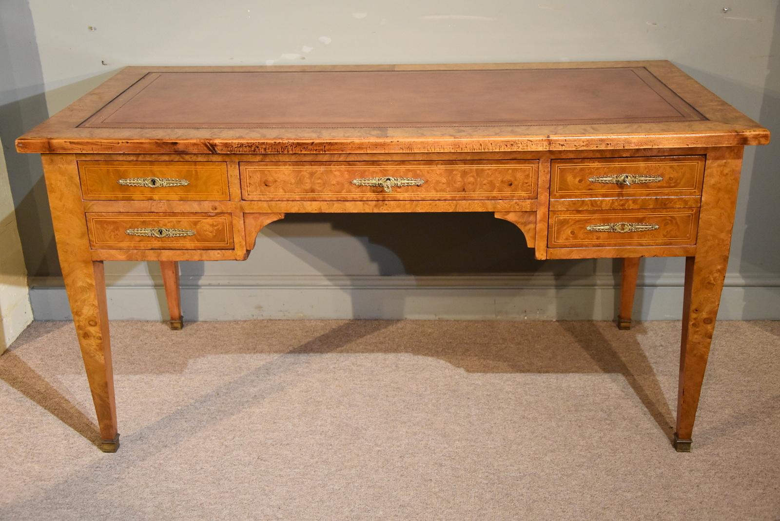 A very good quality French Empire burr elm free standing writing desk and original ensuite armchair 

Measures: Table
Height 30