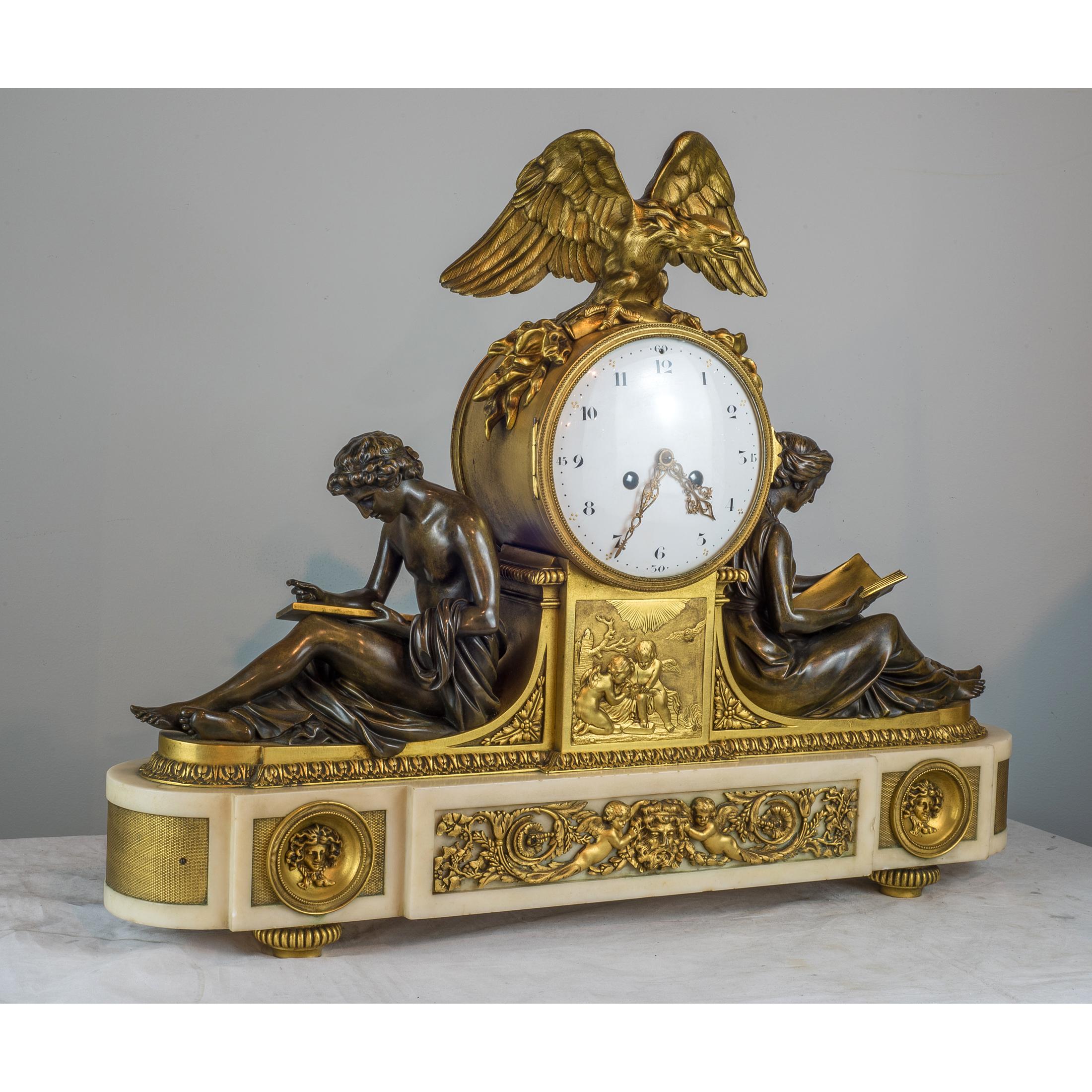 A fine quality gilt and patinated bronze library clock surmounted on a white oblong base. Having a gilt bronze eagle finial in full relief above a circular clock face with Arabic numerals. The clock face flanked by two classical figures reading and