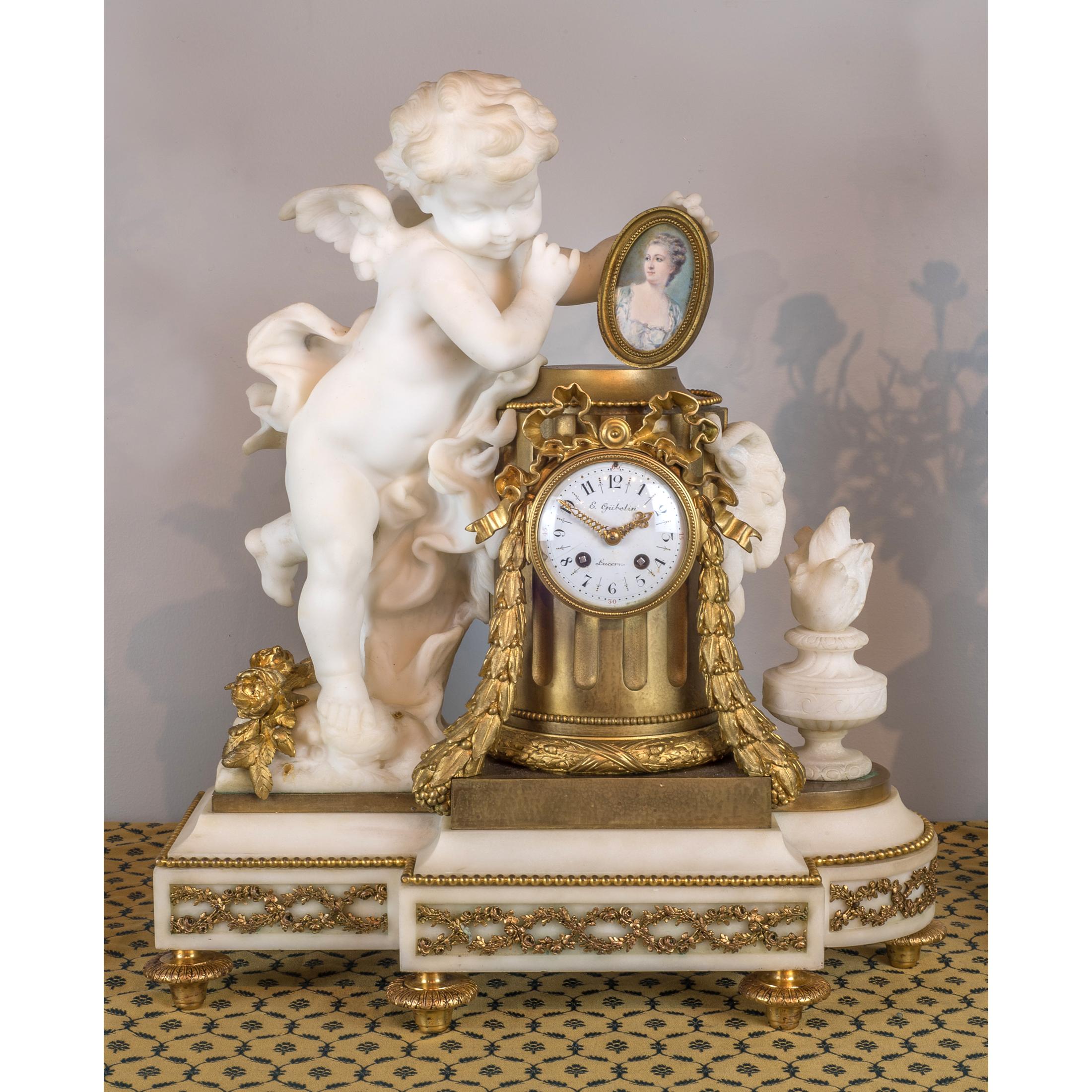 Signed E. GUBELIN, LUCERNE
Date: 19th century
Origin: French
Dimension: Clock: 20 in. x 18 1/2 in.; Candelabras: 22 1/2 inches high.