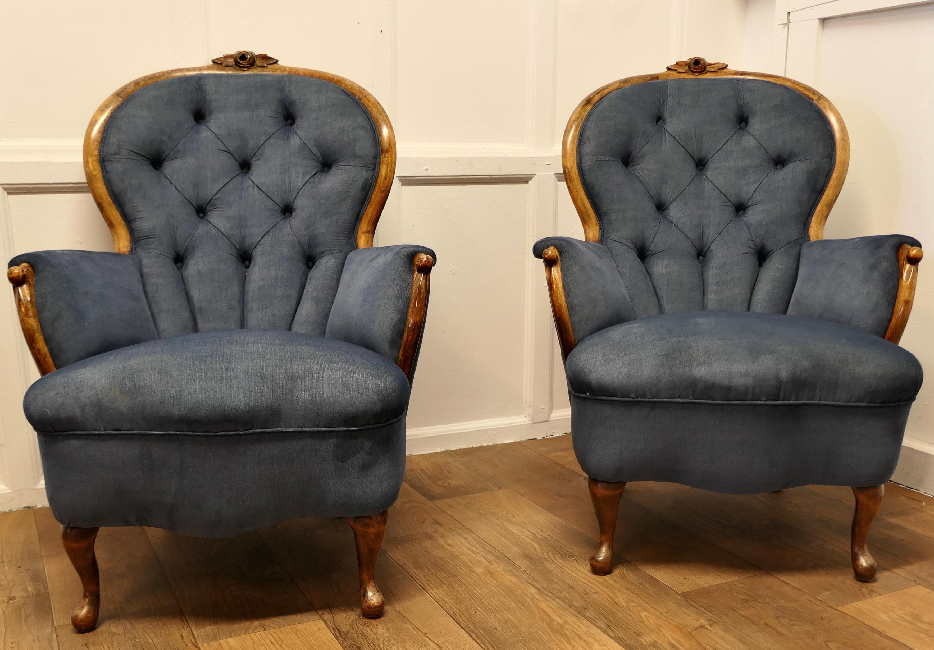 A Fine Quality Pair of French Walnut Button Back Salon Chairs

  These are superbly comfortable arm chairs, they have a rounded deeply buttoned back with a little carving in the Burr Walnut show wood
The Chairs has been upholstered in a fine needle