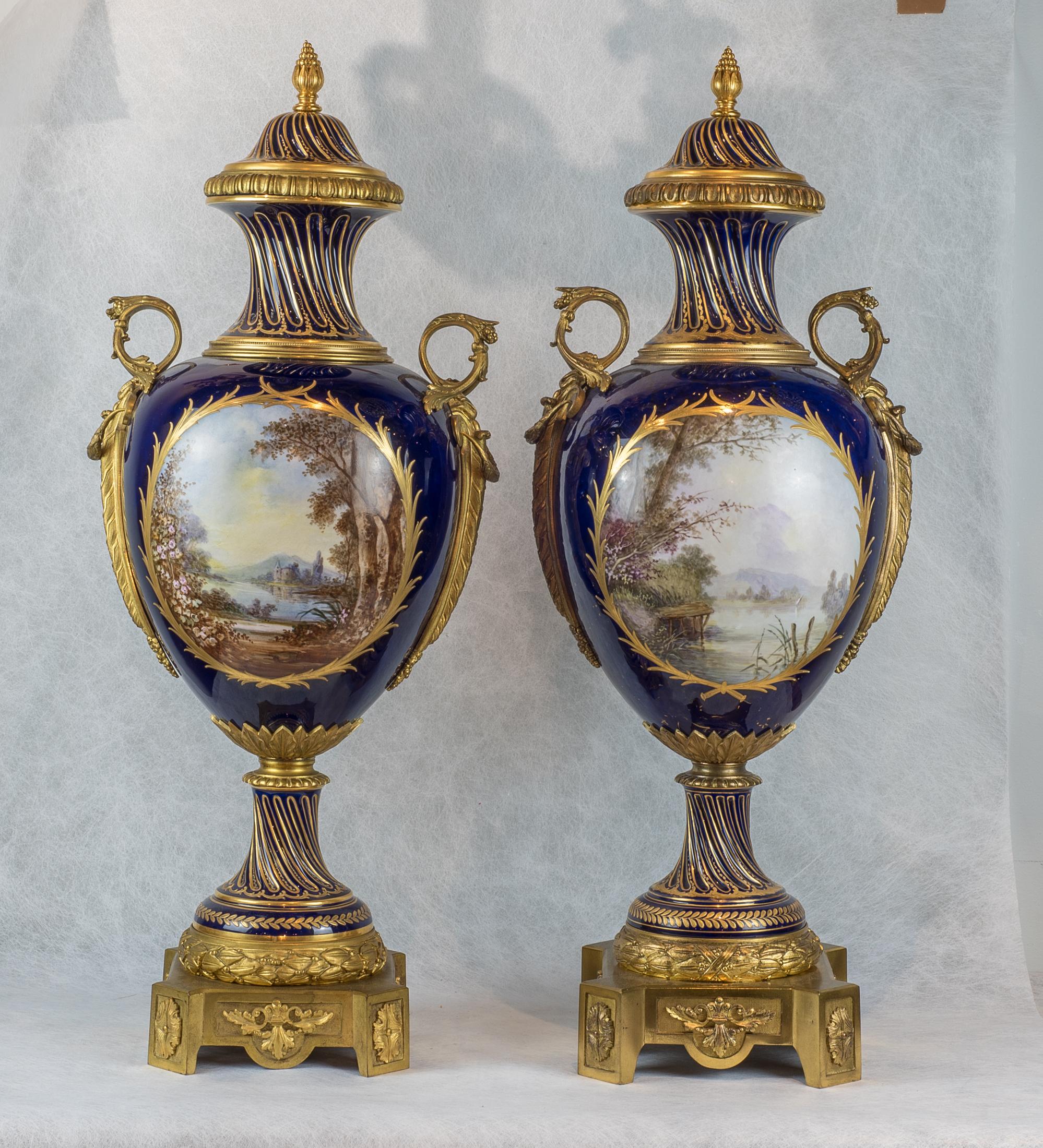 A fine quality pair of large French gilt bronze mounted Sèvres style porcelain vases

Each cobalt ground with raised gold gilding, trumpet form neck decorated with figural lovers in the garden, signed by Poitevin.

Origin: French
Date: 19th