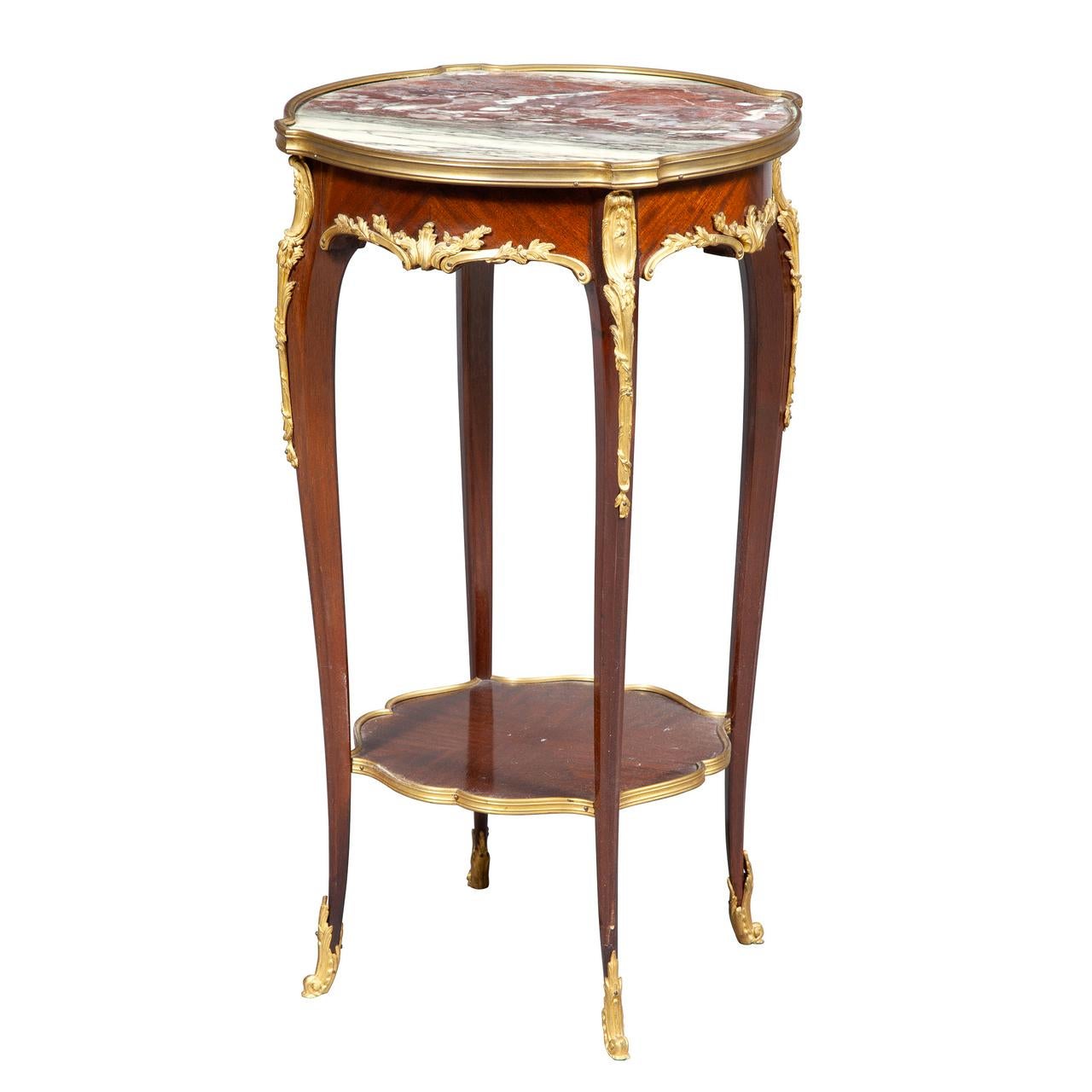 Fine quality pair of Louis XVI-style marble-top side table, the round top with bronze mounts raised on slender cabriole legs joined by a lower shelf.

Origin: French
Date: 19th century
Dimension: Height 29 3/4 x depth 17 3/4 in. diameter.
