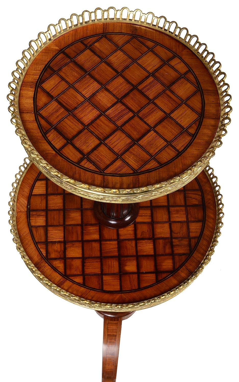 A very good quality matched pair of marquetry inlaid circular two-tier stands with distinctive trellis inlay attributed to Donald Ross with finely cast gilt metal mounts, circa 1860
Donald Ross was a celebrated late 19th Century furniture maker.