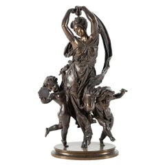 Fine Quality Patinated Bronze Group of Maenad and Cherubs Dancing