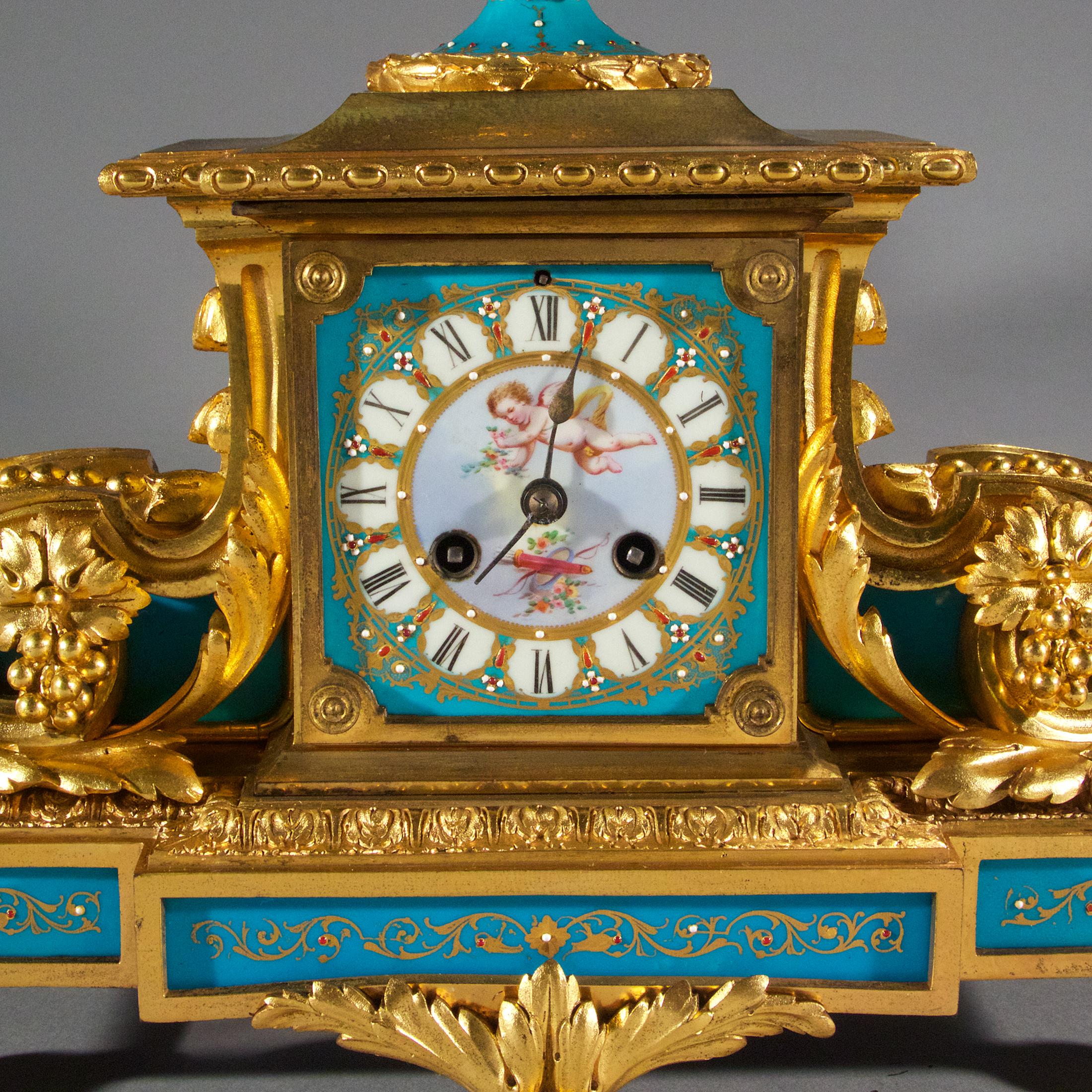 The fine quality Sèvres-style Louis XVI gilt-bronze and jeweled porcelain turquoise mantel clock. Surmounted with a twin handled urn with grapes, the central enamel dial with Roman numerals.

Origin: French
Date: 19th century
Dimension: 12 1/2 x