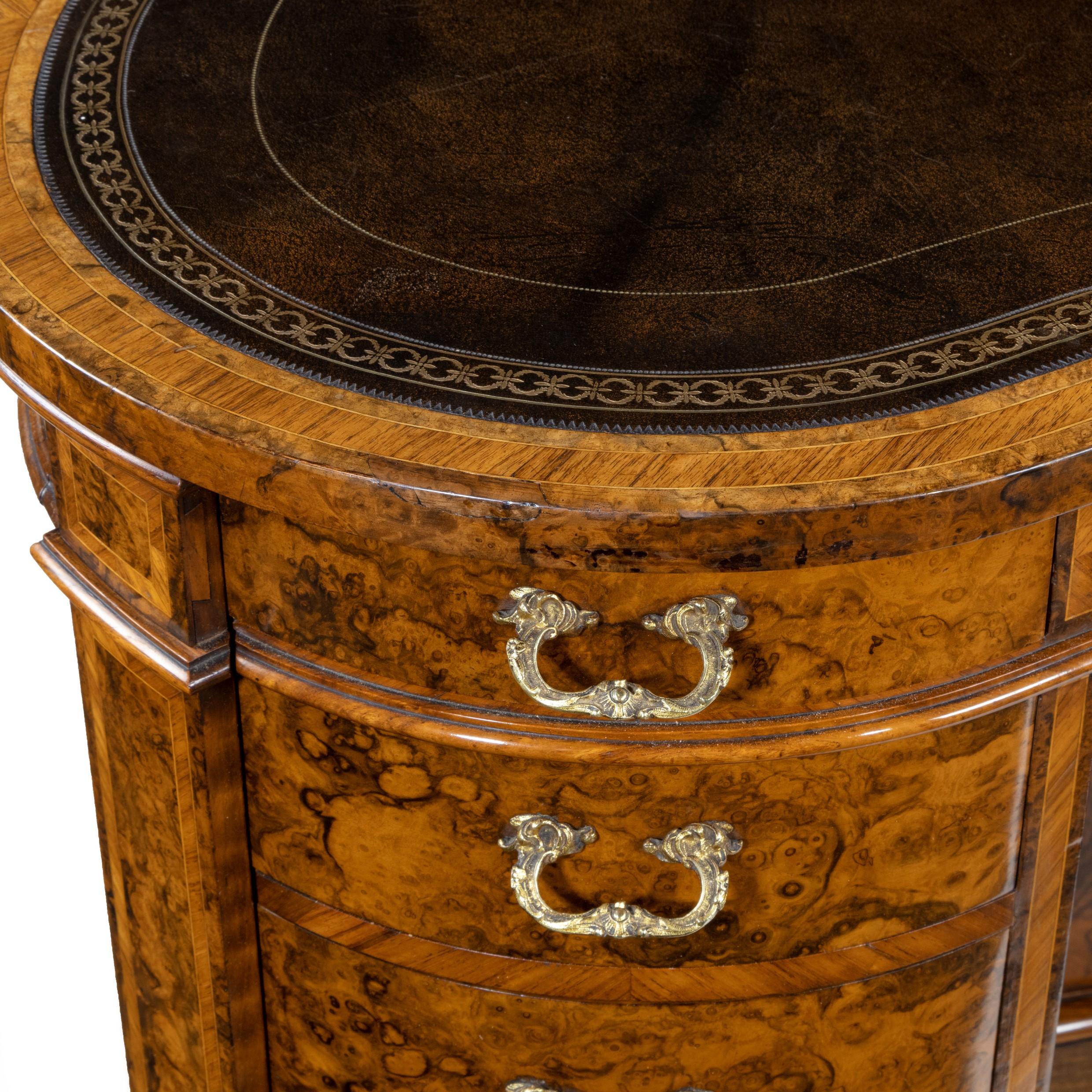 A fine quality Victorian kidney-shaped desk in richly figured burr walnut by Gillows, the leather-inset top, above three drawers in the frieze and four graduated drawers in each pedestal, each with original gilt brass handles, the sides lock by