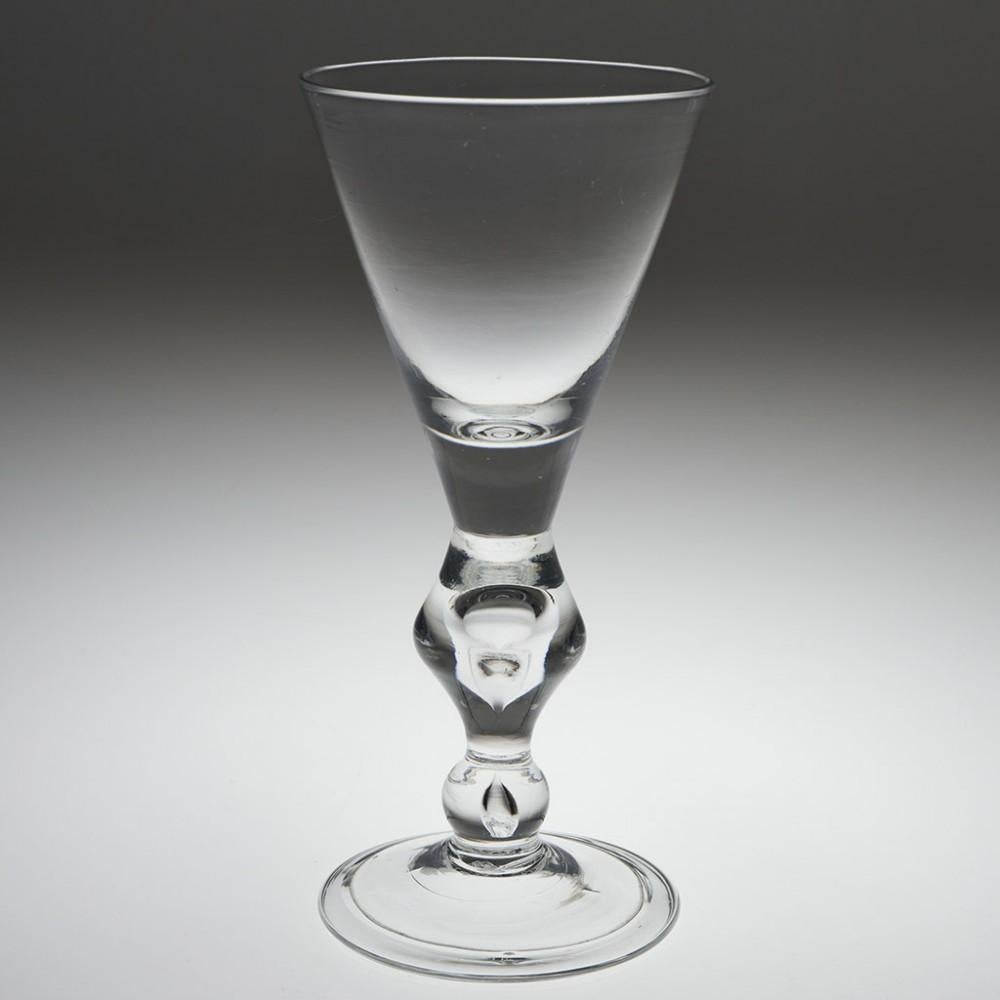 A Fine Queen Anne Baluster Glass Goblet, c1710

A large Georgian baluster wine glass / goblet in excellent condition.

We always prefer to be on the most conservative side with dating and this remains the case.

Quite how anyone with any
