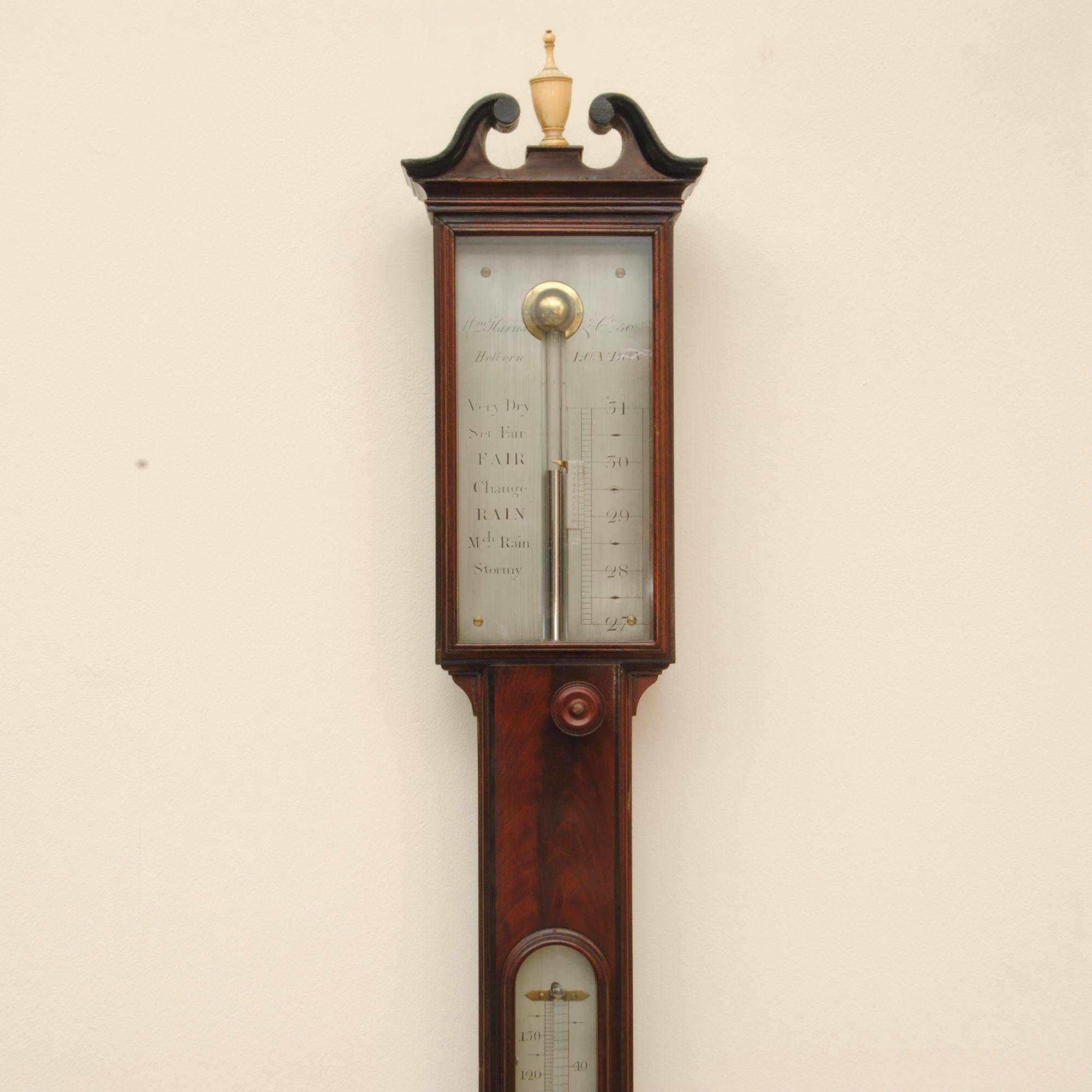 A Regency period mahogany stick barometer of fine quality with flame veneers and ebony stringing, the silvered dial signed by William Harris, Holborn, London
The original ivory finial is registered on the ivory list, number available on request.