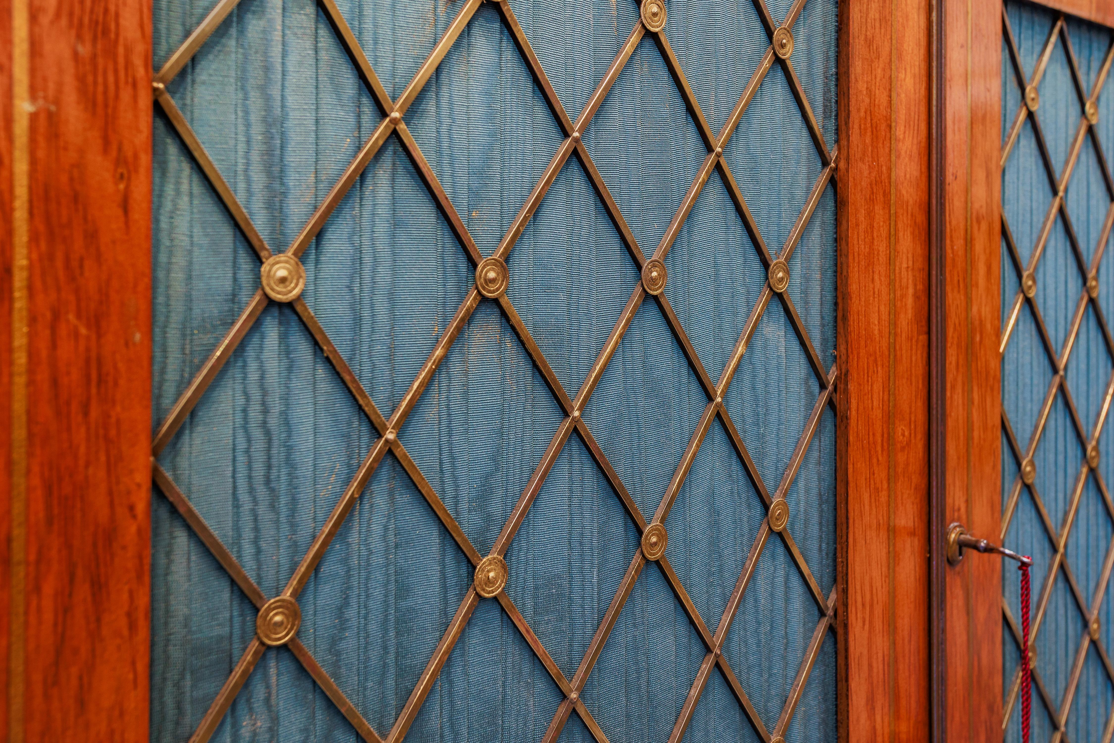 A fine Regency rosewood and brass inlayed  cabinet. Marble top with brass mesh In Good Condition In Dallas, TX