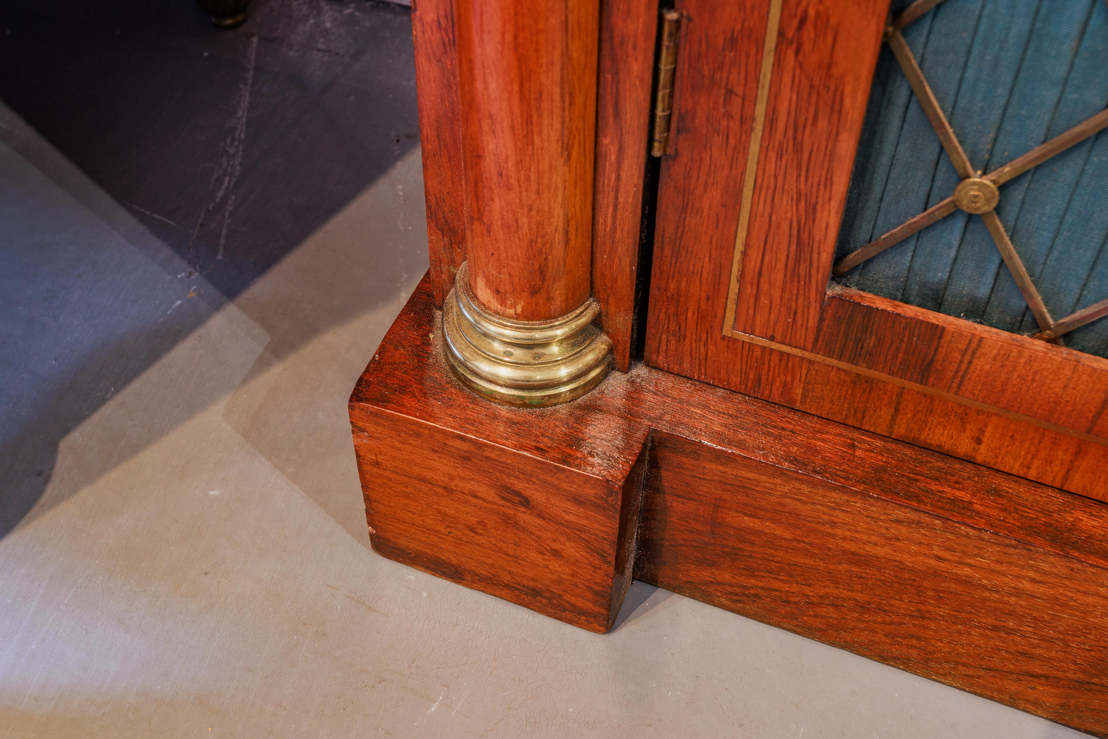 19th Century A fine Regency rosewood and brass inlayed  cabinet. Marble top with brass mesh