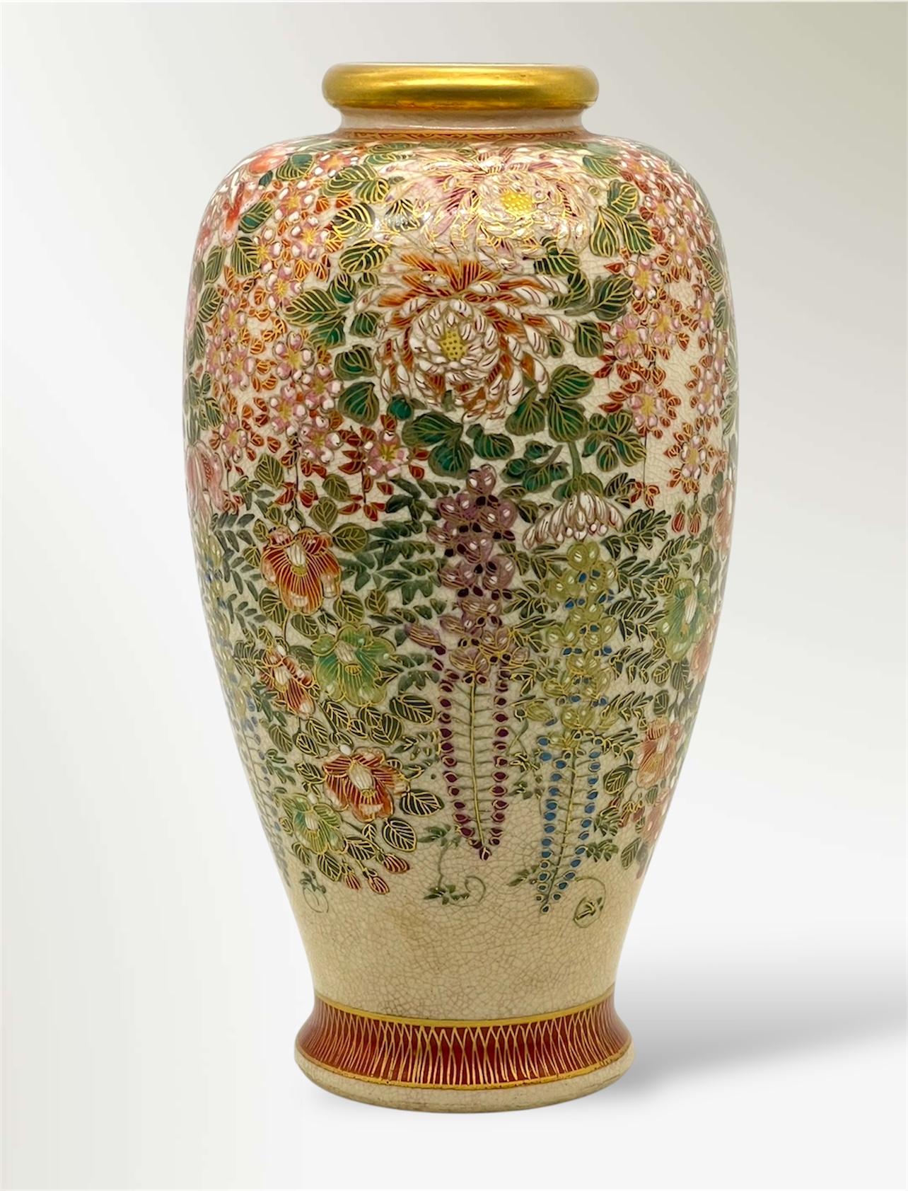 A Fine Satsuma Millefleurs Vase
Taishō Period signed Nakazawa 

Of ovoid form with a short neck and gilt rim, the body richly decorated in polychrome enamels and gilt with a dense millefleurs design of chrysanthemums, wisteria, and peonies,