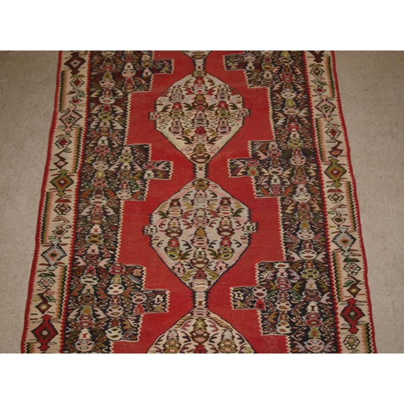 Asian A Fine Senneh Kilim Runner with Soft Colours and a Linked Medallion Design For Sale