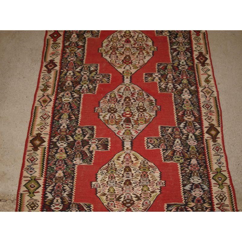 A Fine Senneh Kilim Runner with Soft Colours and a Linked Medallion Design In Good Condition For Sale In Moreton-In-Marsh, GB