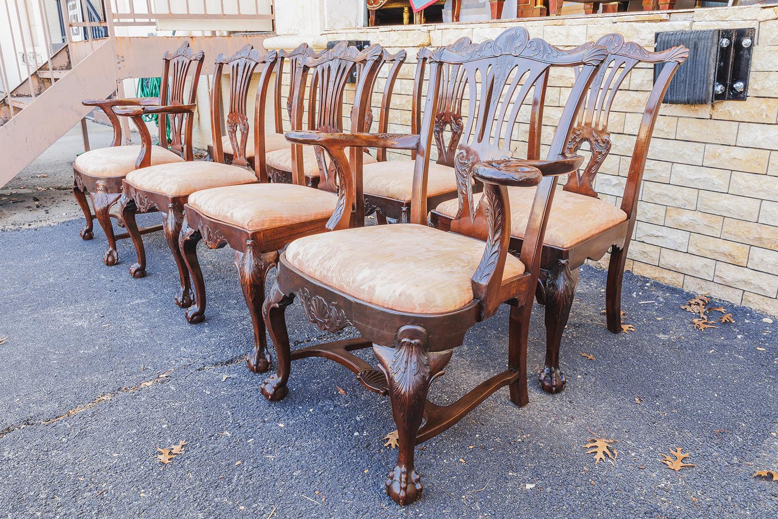 A fine set of 19th c  8 Irish Chippendale finely carved dining chairs. Comprising of 2 heavily carved arms and 6 sides. These chairs are heavily carved with fine eagle heads on the arm chairs and ball and claw feet.  The butler family produced fine