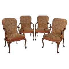 A Fine Set of Four George II Style Walnut Armchairs with Original Needlework