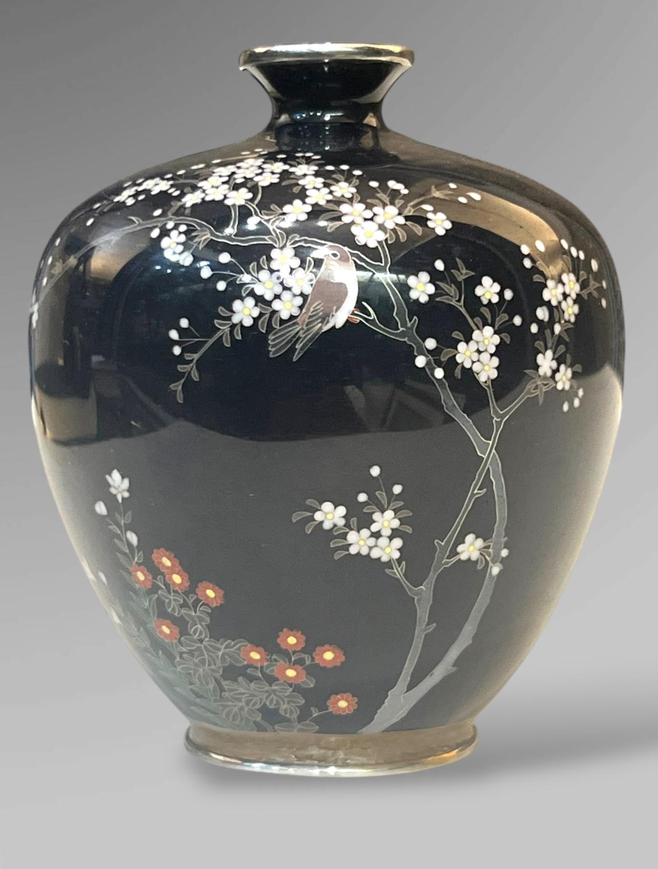 A Silver-Mounted Cloisonné-Enamel Vase
By Satō, Meiji era 

By Satō, Meiji era (late 19th century), circa 1890–1900

Of globular form with a gently tapered neck, the body worked in yūsen-jippō (wired cloisonné) enamels on a glossy jet-black ground,