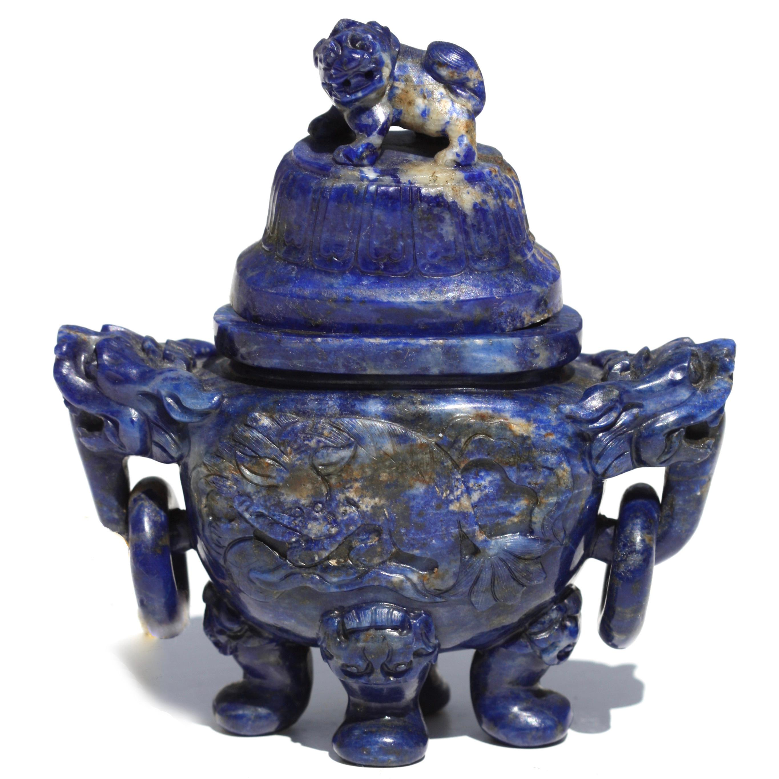 Fine sodalite burner and cover
Chinese
20th Century
Flanked by foo dog handles with loose rings resting upon four feet, the cover with foo-fog finial. The softly polished stone is of a blue color with white inclusions.
Measure: 4.25 in. (10.62