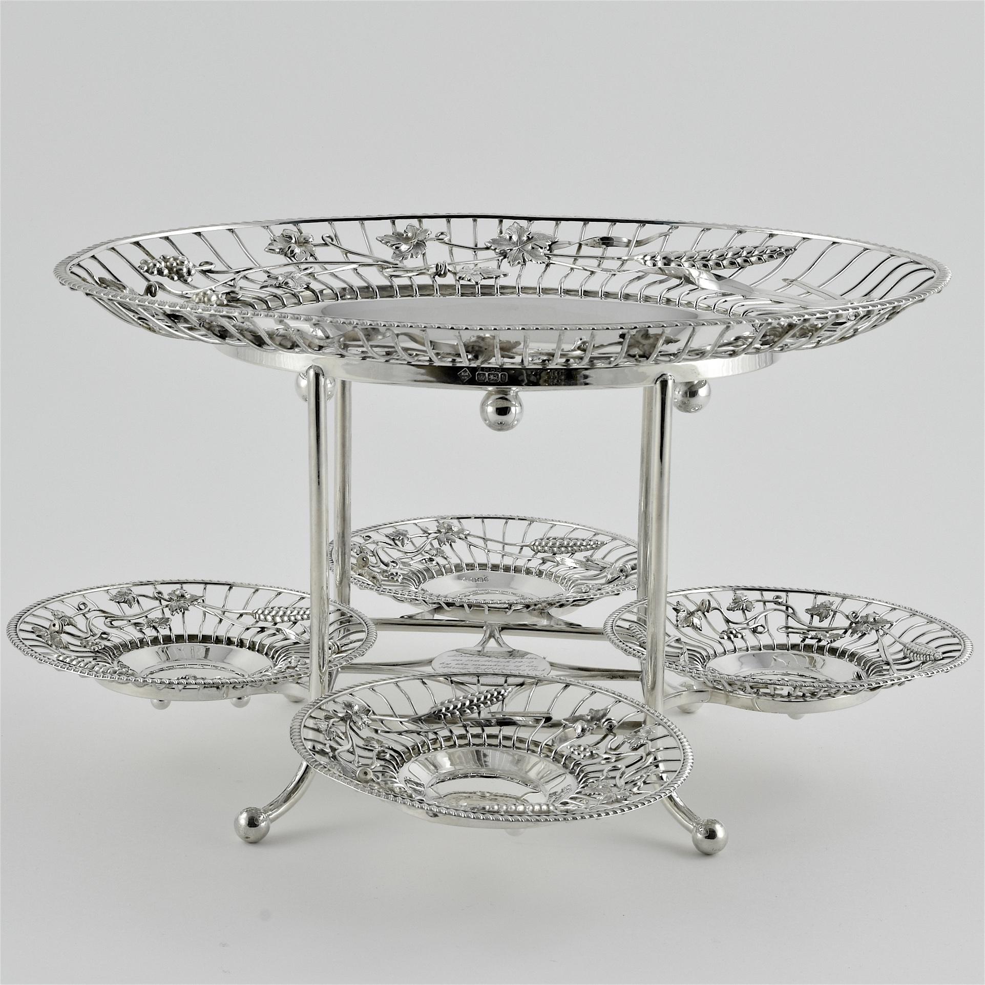 This unusual and elegant five-dish epergne, with hallmarks For Richard Martin and Ebenezer Hall would make a perfect centrepiece for the dining table for fruits or desserts, but equally for afternoon tea with cakes, Scones and sandwiches in the