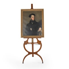 A fine Victorian brown oak and marquetry easel of elegant scrolled form
