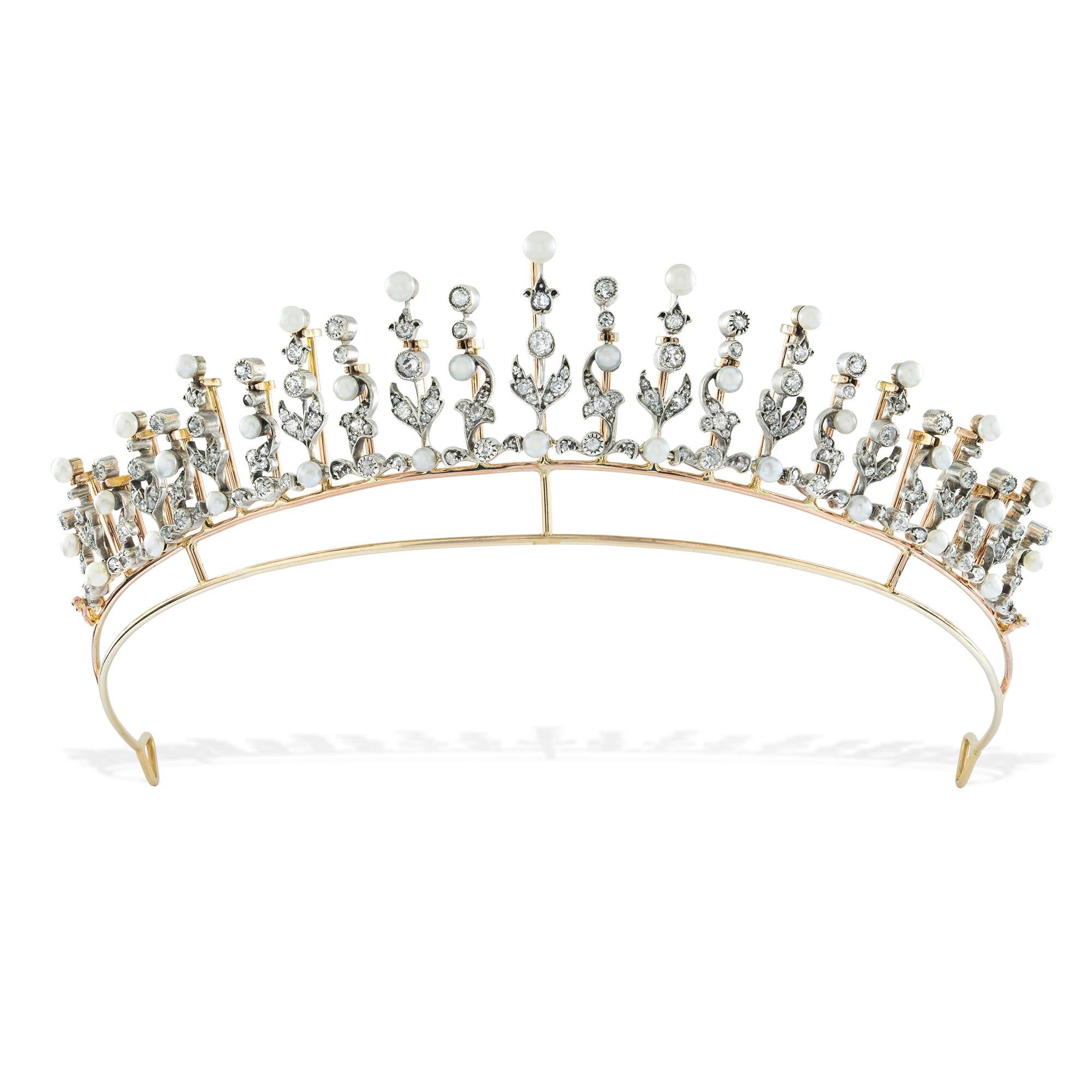 A Fine Victorian diamond and pearl tiara/necklace, the twenty-three floral design stems graduated from the centre, encrusted with  one hundred and seventy-seven old European and rose-cut diamonds and flanked with thirty-four natural pearls, the