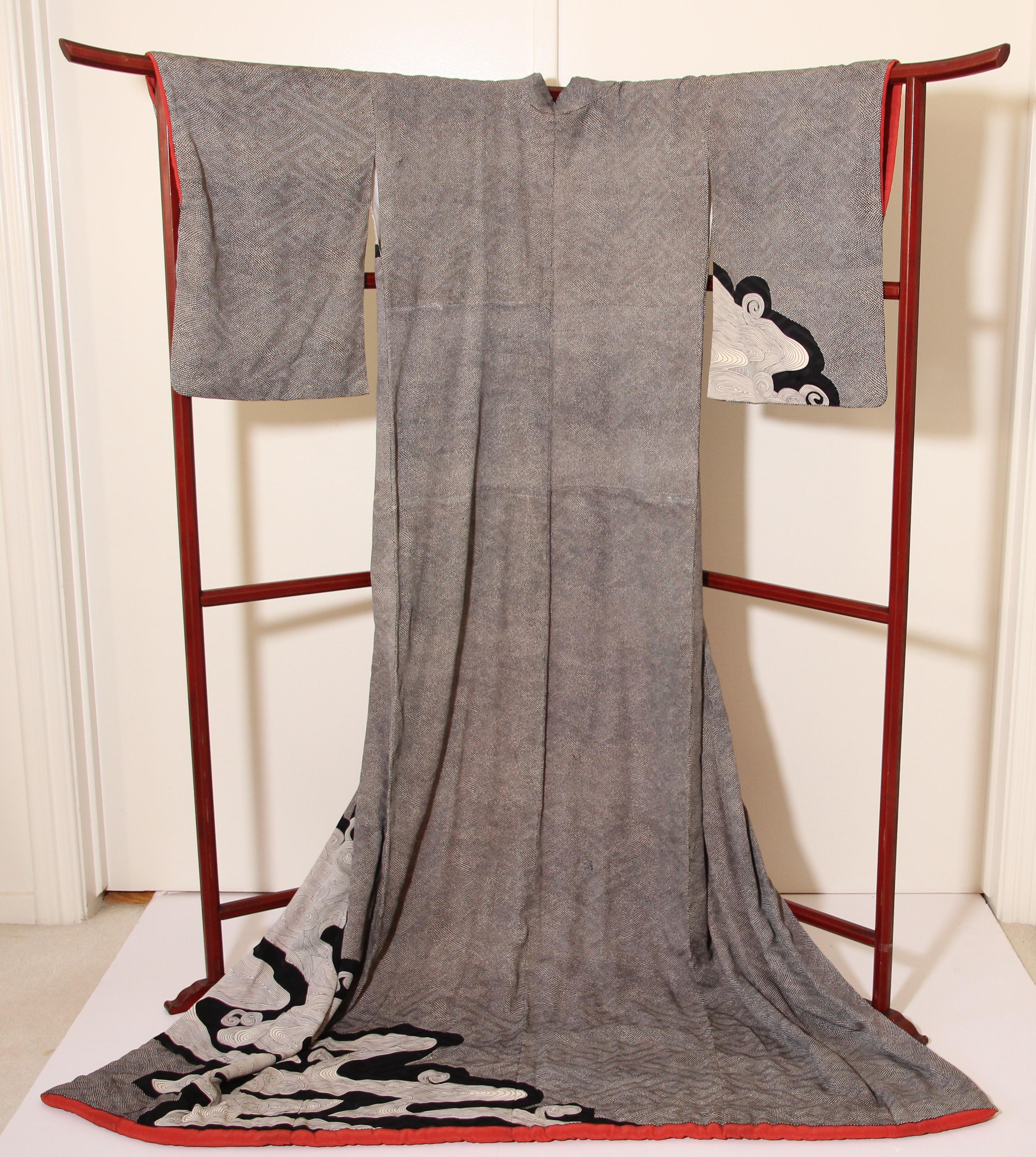 A fine Japanese Kuro Tomesode Kimono, circa 1950s.
silk kimono robe in dove grey with an abstract pattern.
The fine design was done with Yuzen, a painstaking resistant dye technique using rice starch. Yuzen was invented in the 17th century and