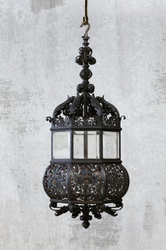 A Fine Wrought Iron And Glass Four-Light Hanging Lamp
