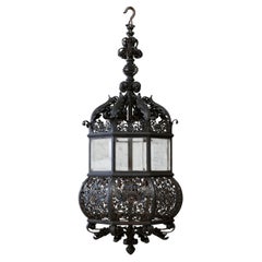 A Fine Wrought Iron And Glass Four-Light Hanging Lamp