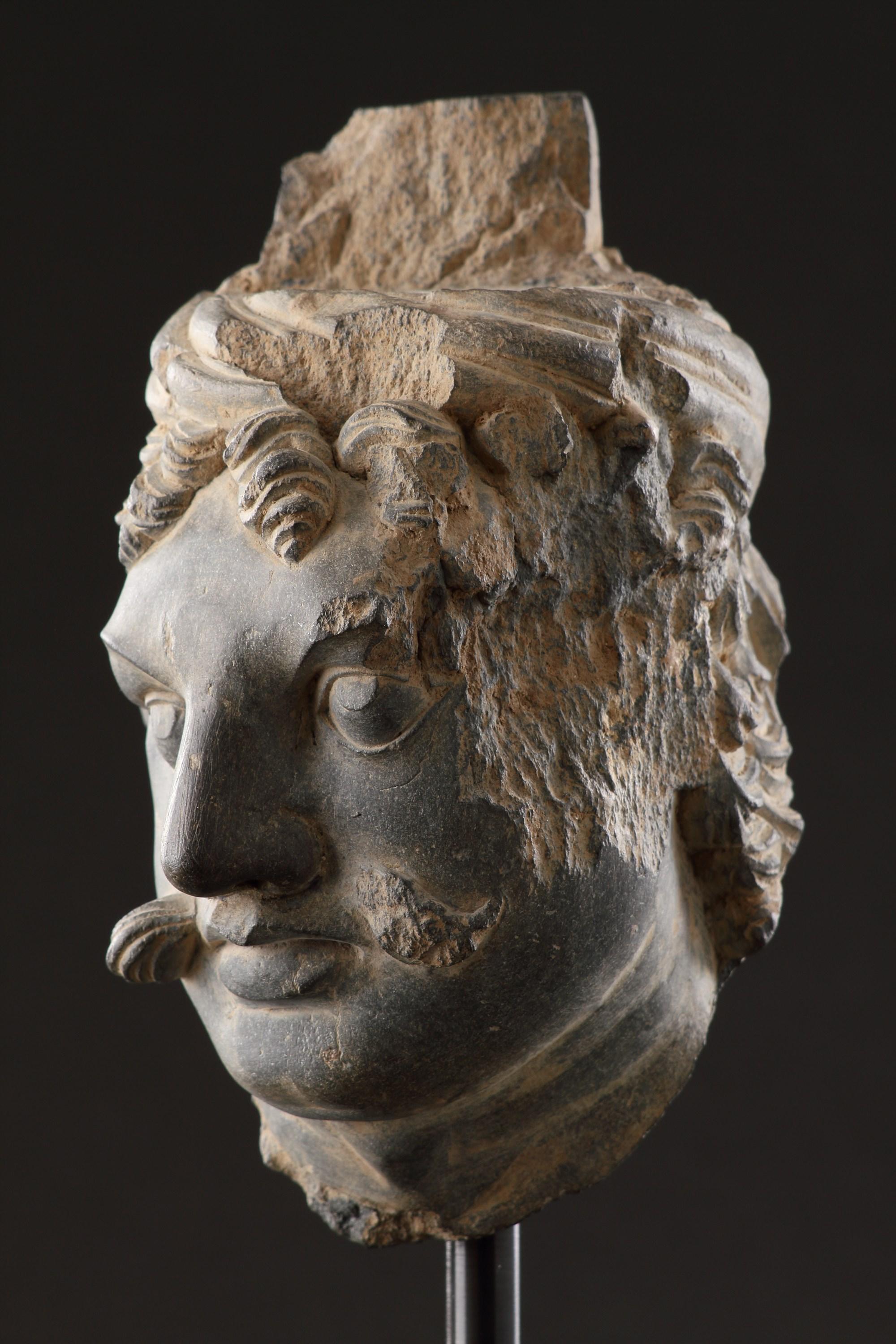A Finely Carved Gandhara Head of ‘Atlas’ In Good Condition For Sale In London, GB