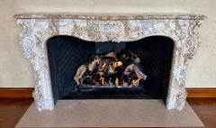 A Finely Carved Louis XV Style Fireplace Mantel in Figured Italian Marble