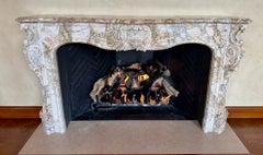 A Finely Carved Louis XV Style Fireplace Mantel in Figured Italian Marble