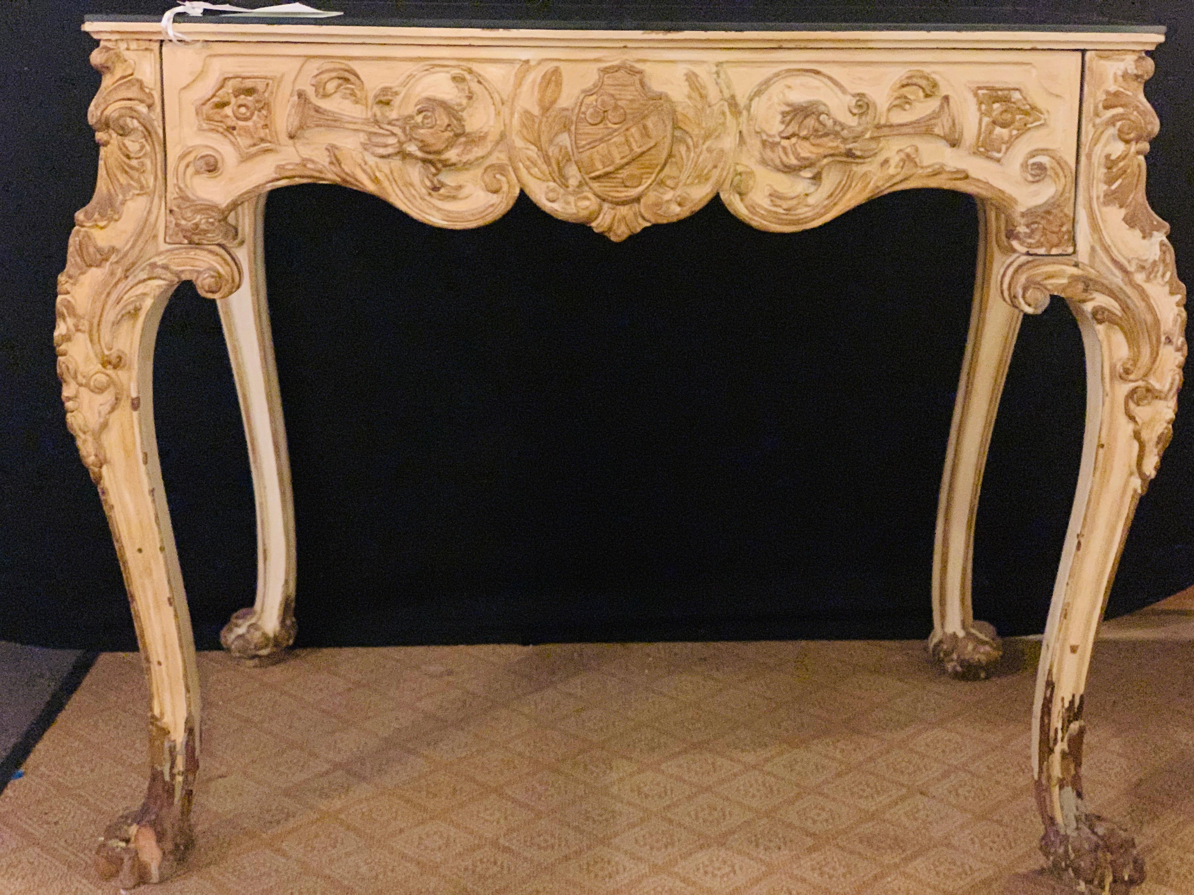 A finely carved late 19th early 20th century Hollywood Regency white and parcel-gilt decorated vanity by Jansen having a mirrored top and a single center drawer.
