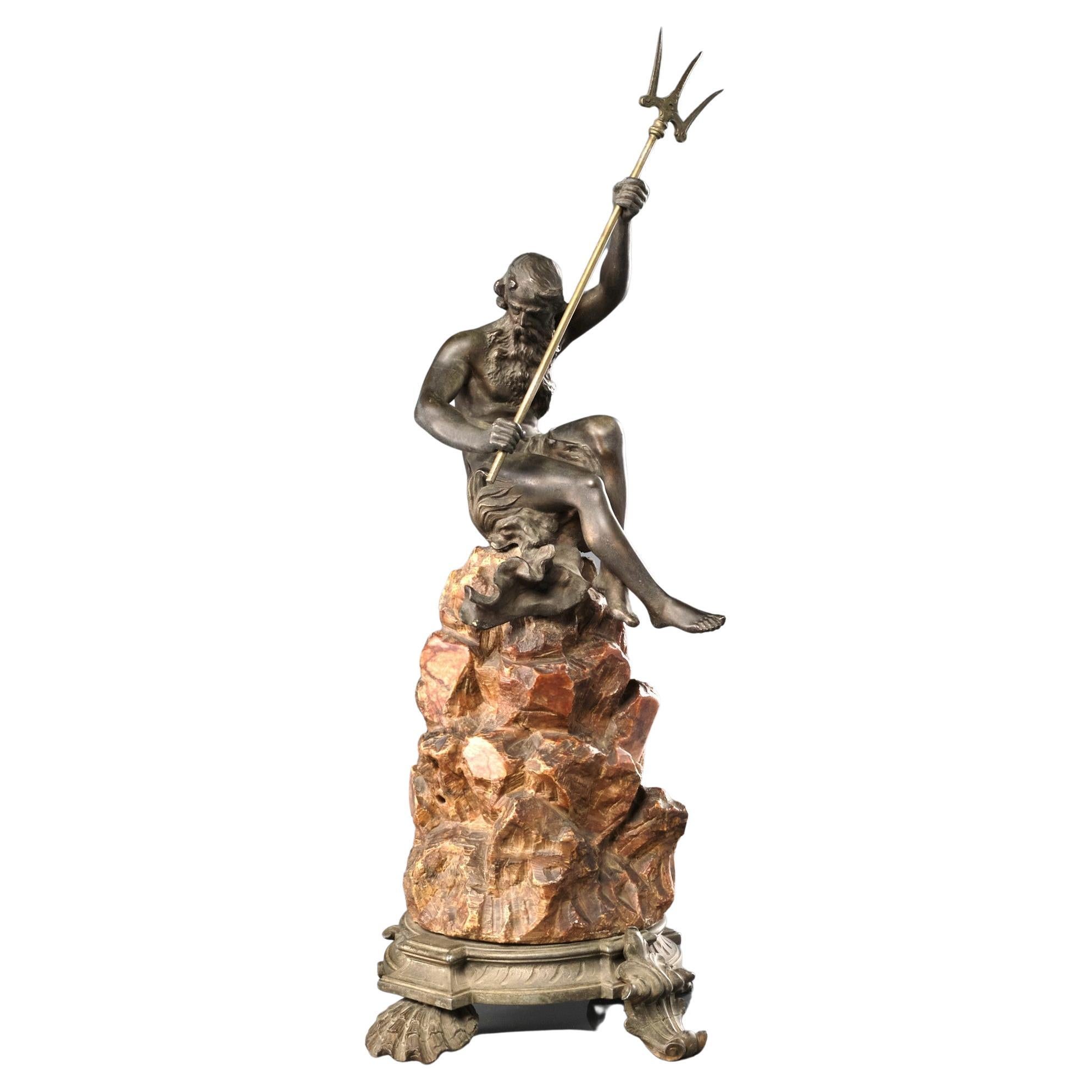 A Finely Cast Spelter Figure of Neptune Mounted Atop a Carved Soapstone Base  For Sale