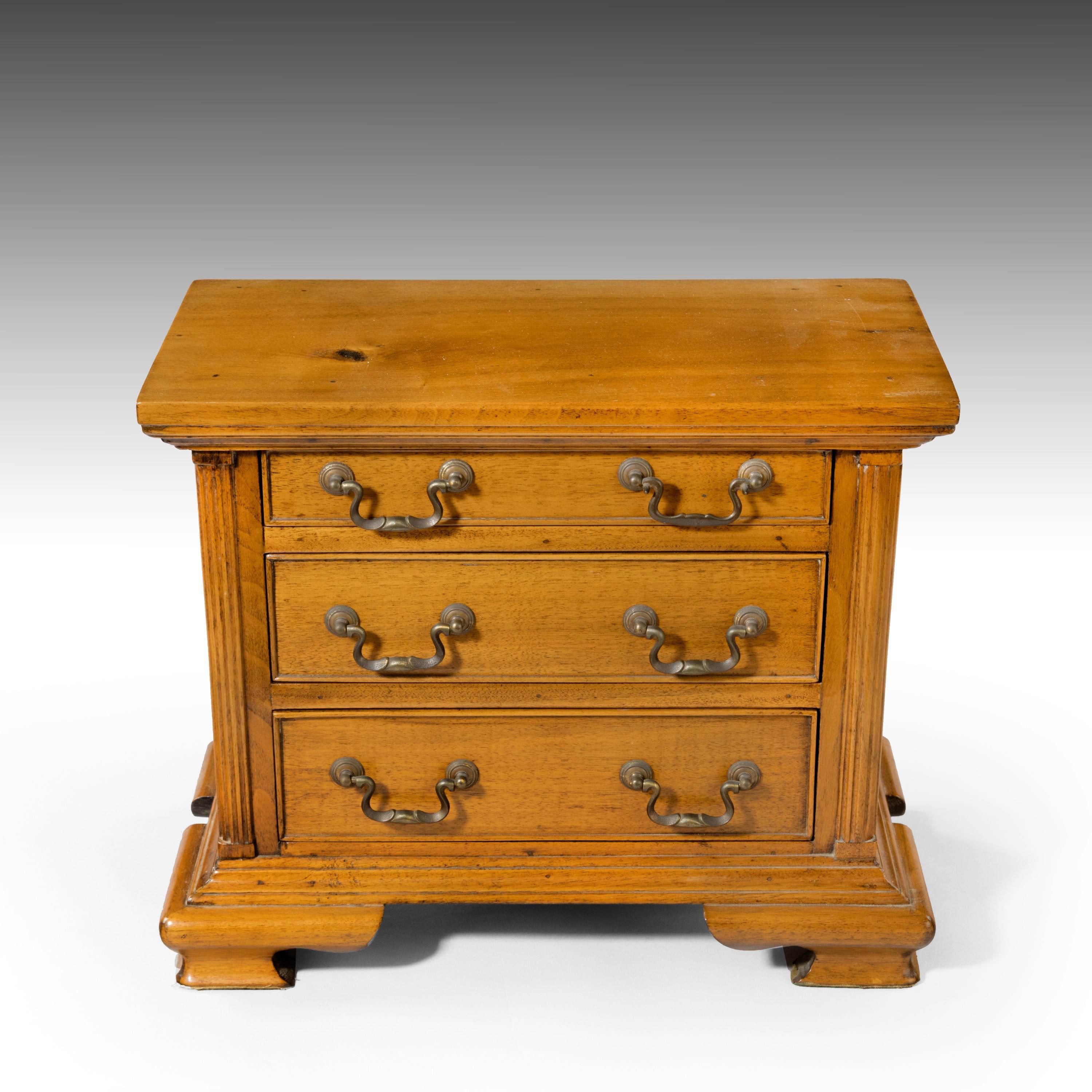 A very finely made apprentice chest of drawers in golden mahogany. With swan-necked bronze handles and very strongly formed ogee feet.
 