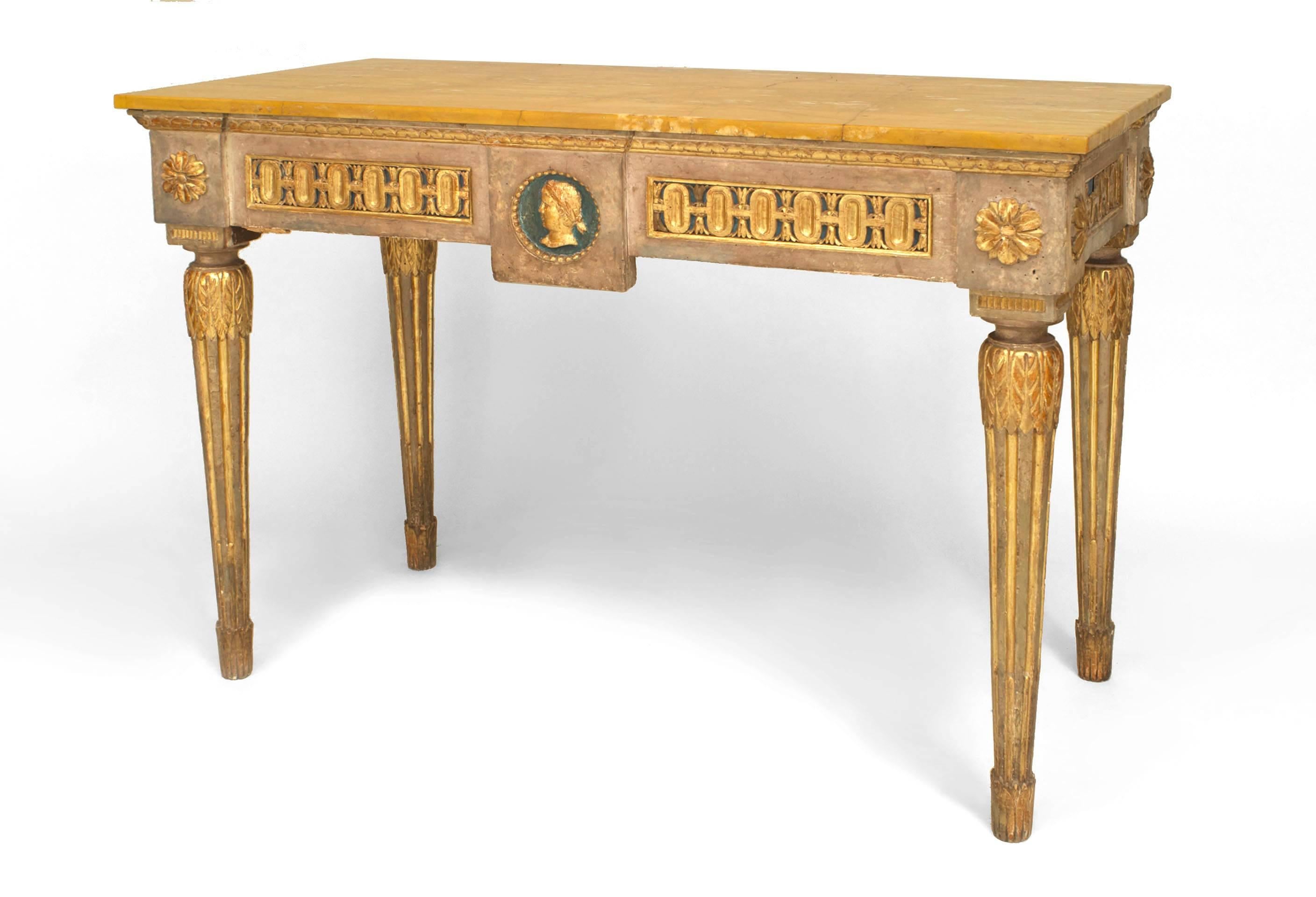 Italian Neo-classic (Late 18th Century) grey painted & parcel gilt trimmed console table with a centered head in relief on the apron supporting a breche arquelino veneered marble top all on four fluted legs.
