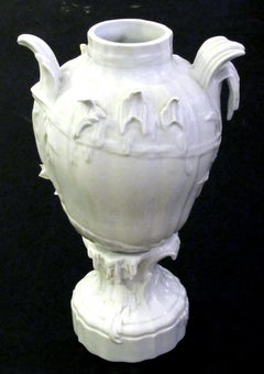 Finely Rendered Pair of French Rococo Style Blanc-de-chine Urns or Vases