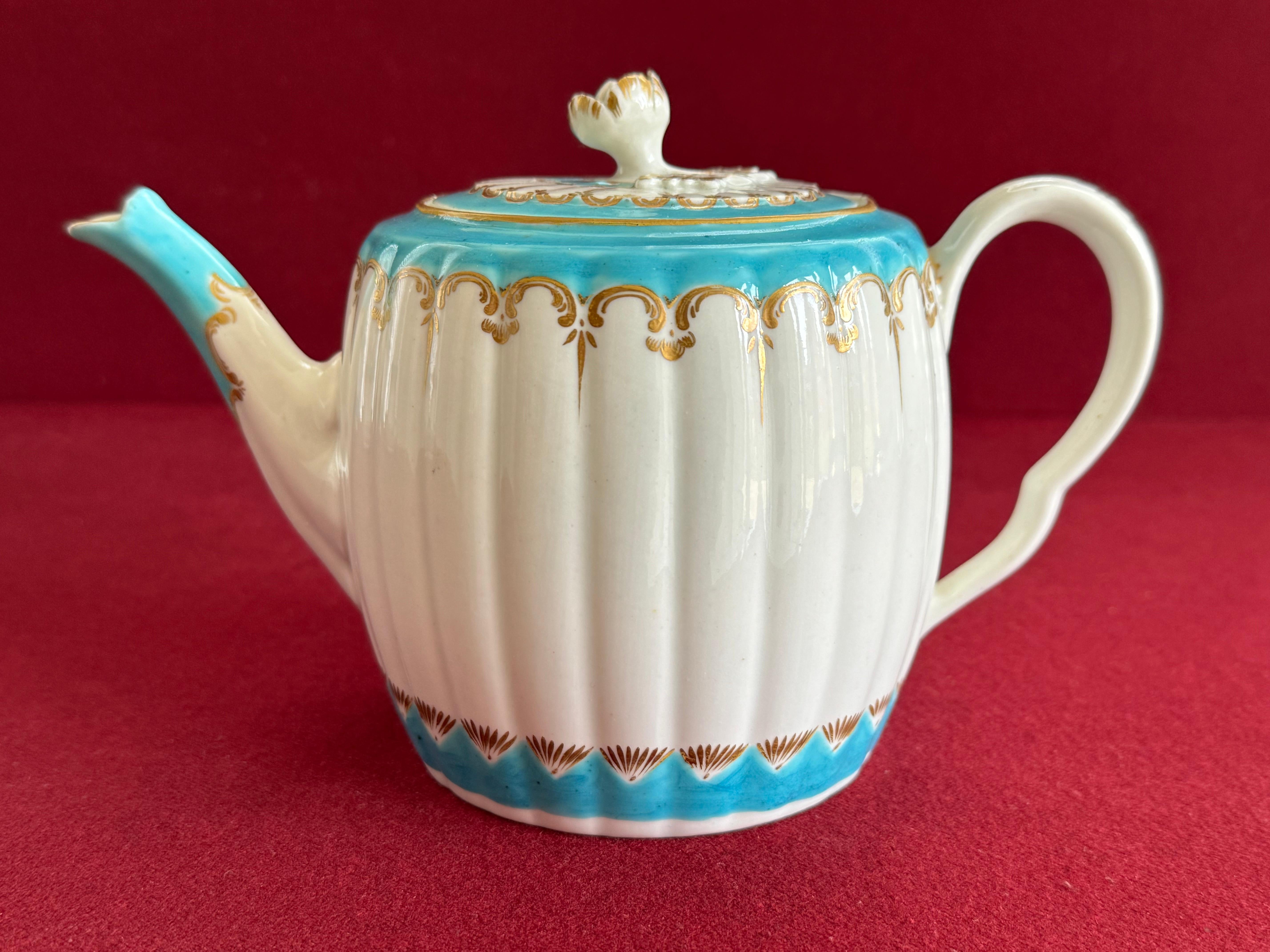 An exquisite First Period Worcester Porcelain Teapot c.1780. Of barrel shape, with vertical fluting, rose flower finial & a very elegant ‘bleu celeste’ ground borders & gilded decoration.



Condition: Excellent with no damage or restoration and