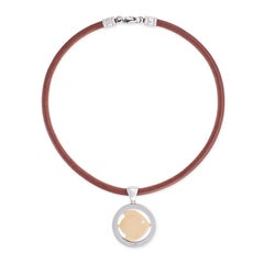 A fish tondo necklace by Bulgari