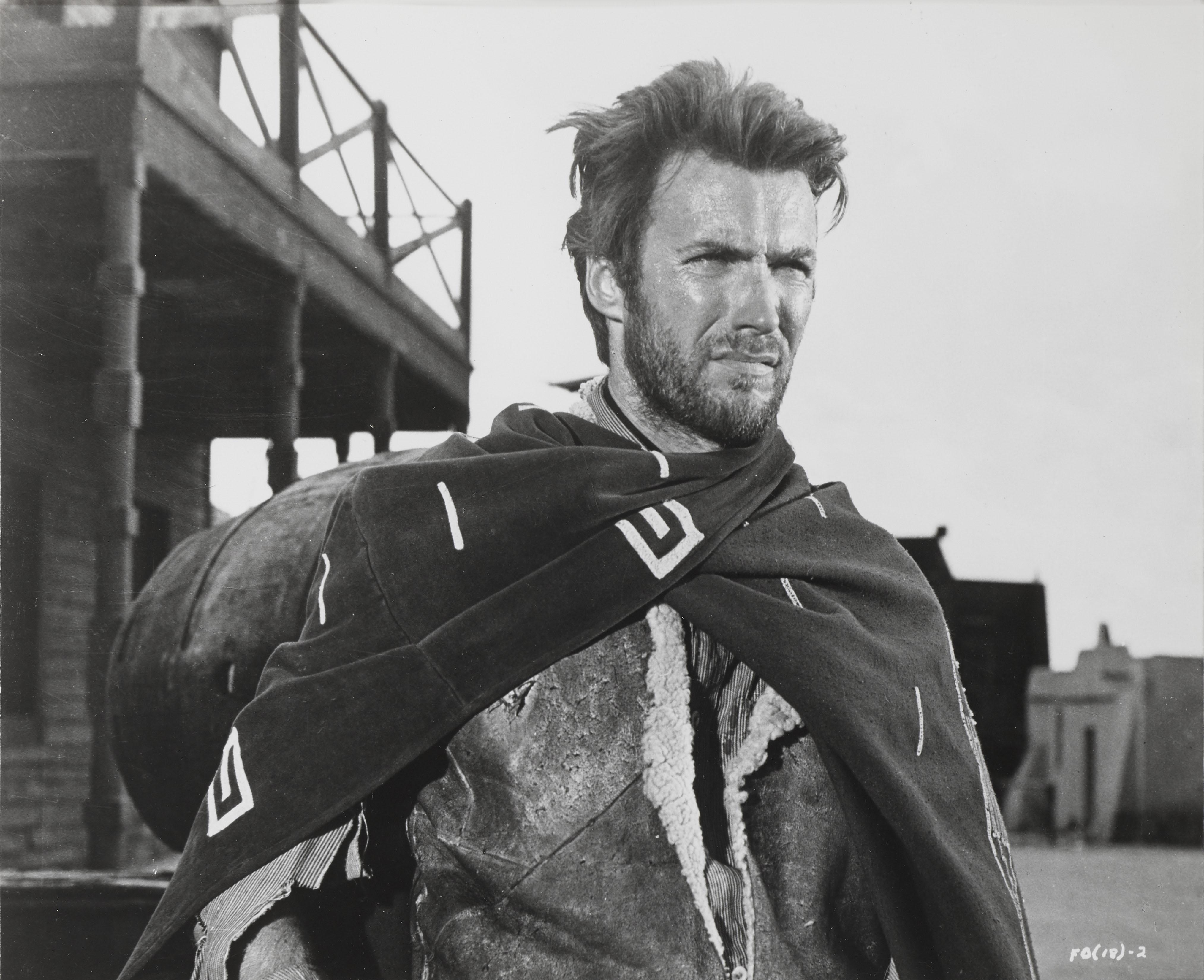 Original US photographic production still from the film A Fistful of Dollars 1964.
This film was directed by Sergio Leone, and starred Clint Eastwood in the first of his Dollars trilogy. This piece is framed in a Sapele wood
frame with acid free