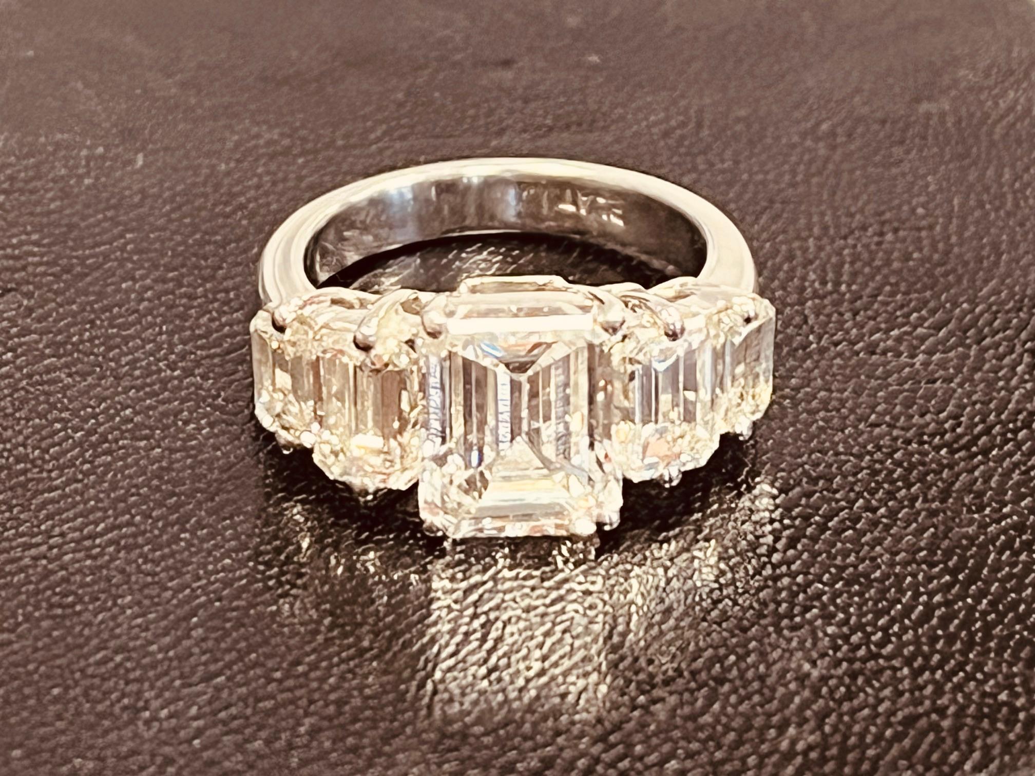 A Five Stone Diamond Ring Centring A 3cts Emerald-cut Diamond For Sale 10