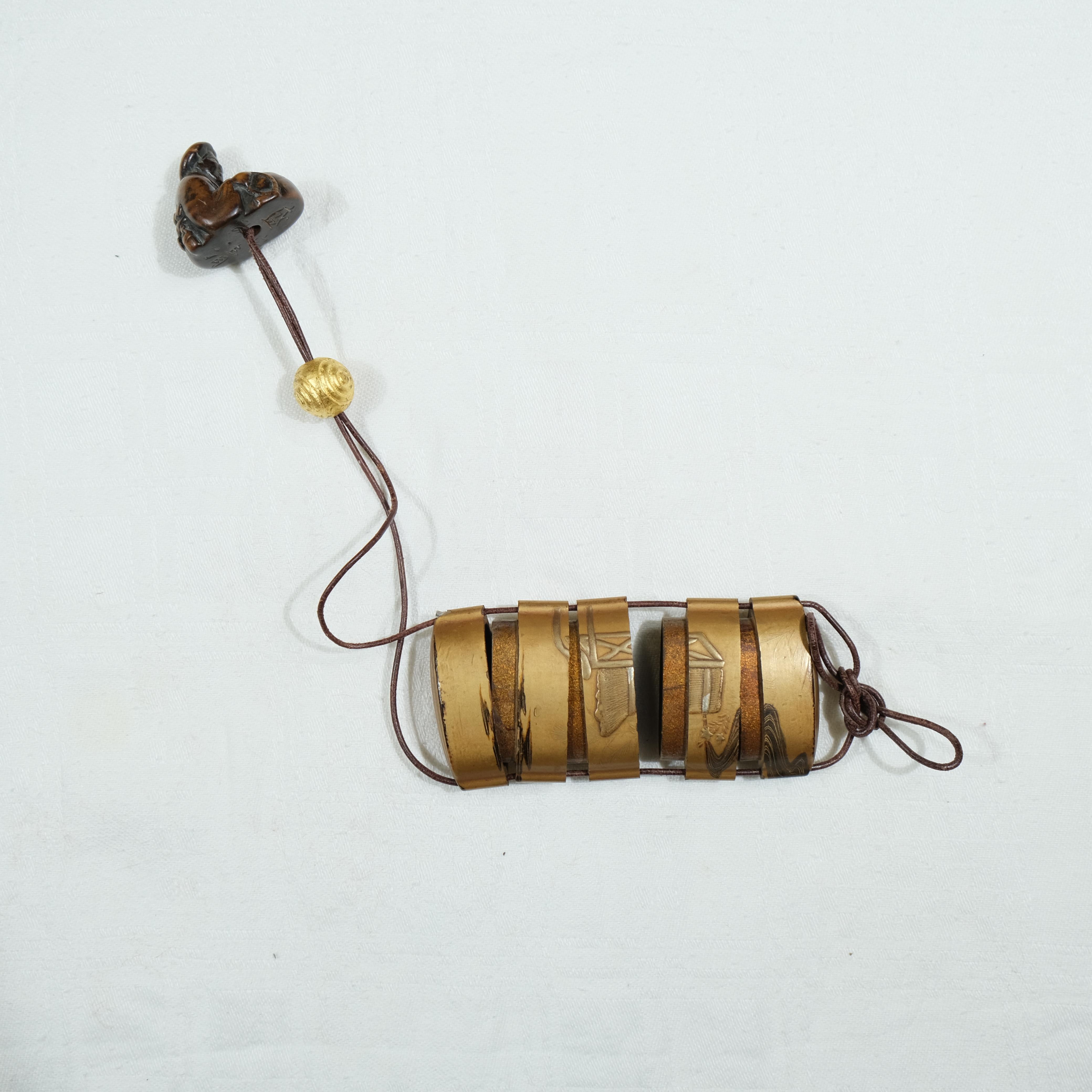 A fivepart Japanese lacquer inro with netsuke, late 19th c. For Sale 3