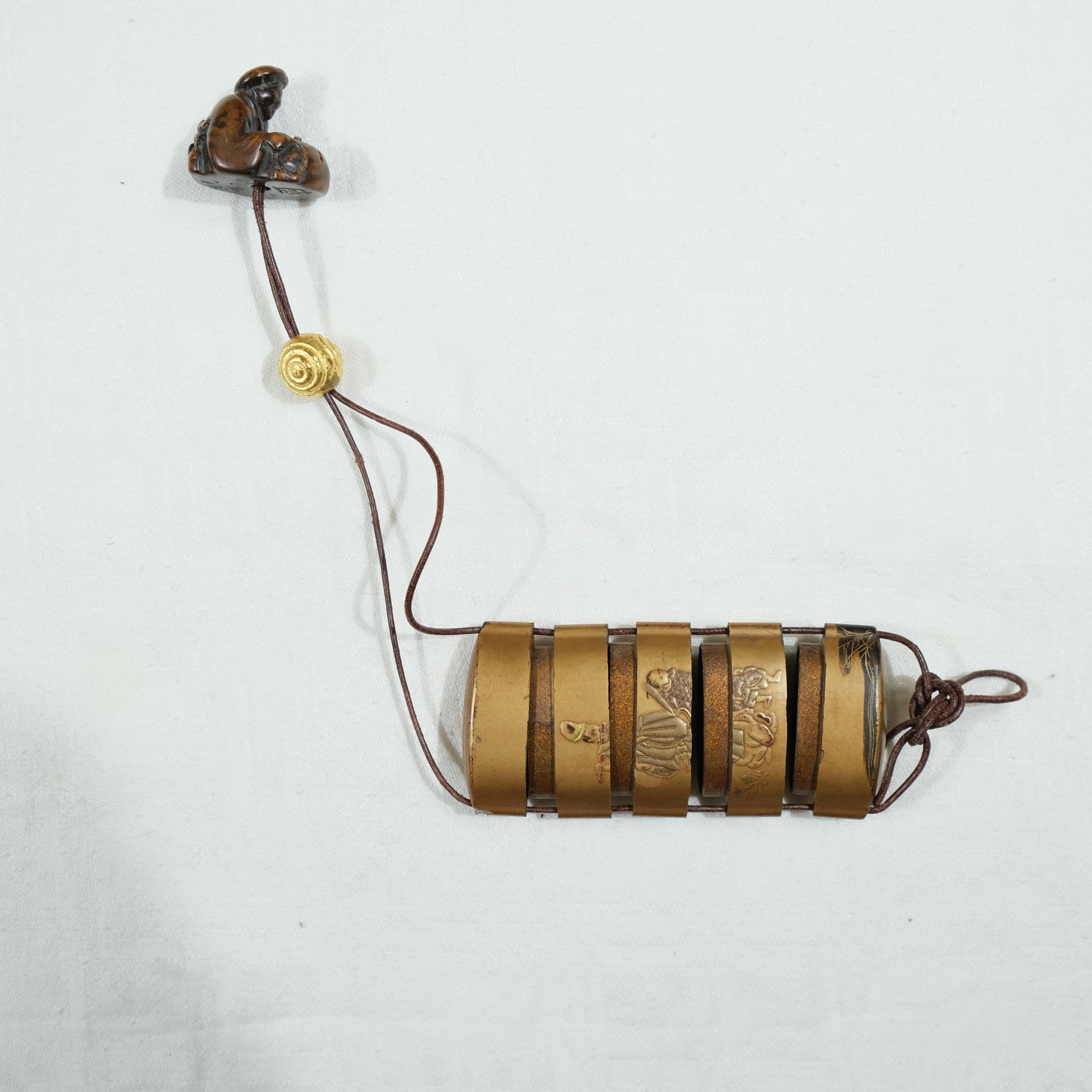 A fivepart Japanese lacquer inro with netsuke, late 19th c. For Sale 4