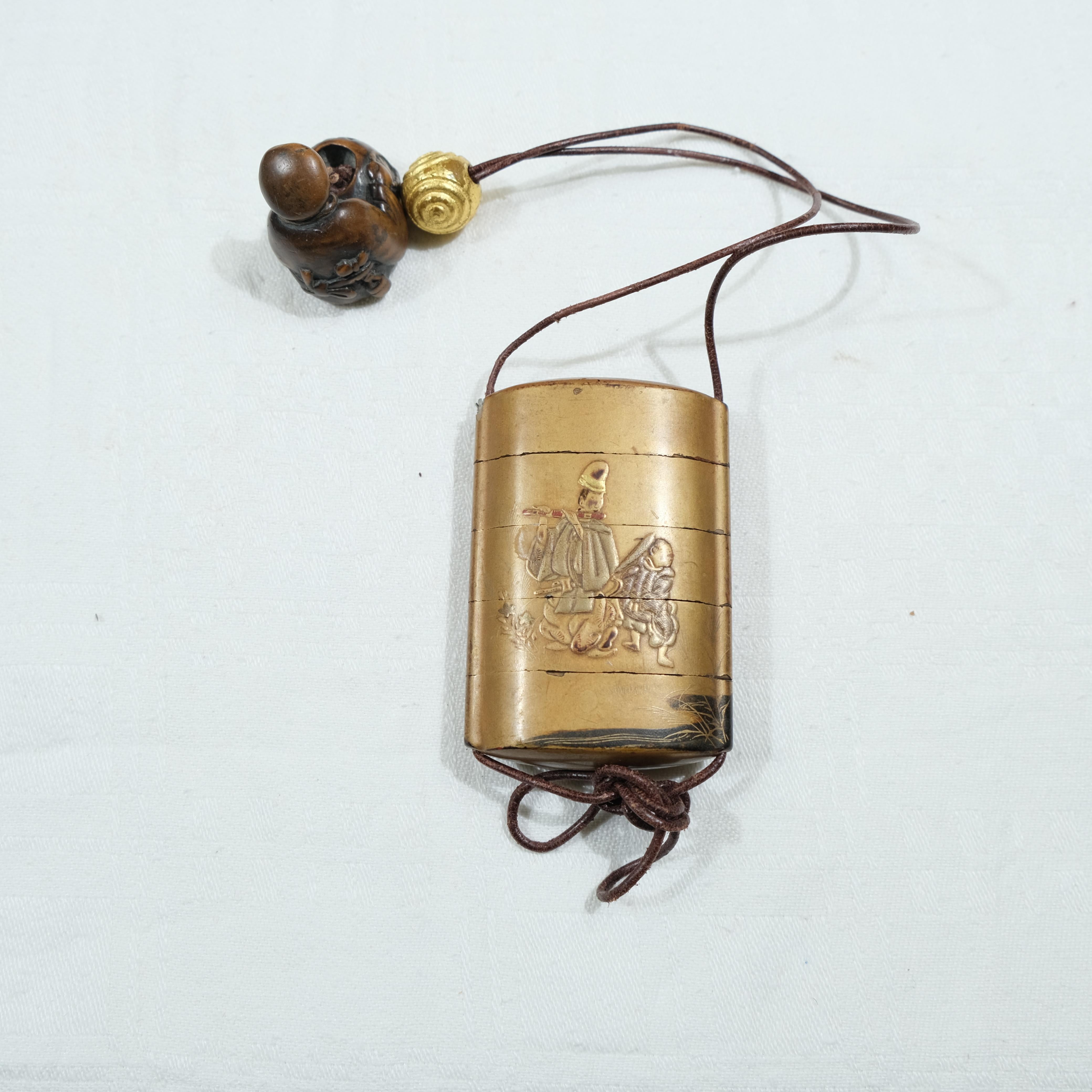 A fivepart Japanese lacquer inro with netsuke, late 19th c. For Sale 5