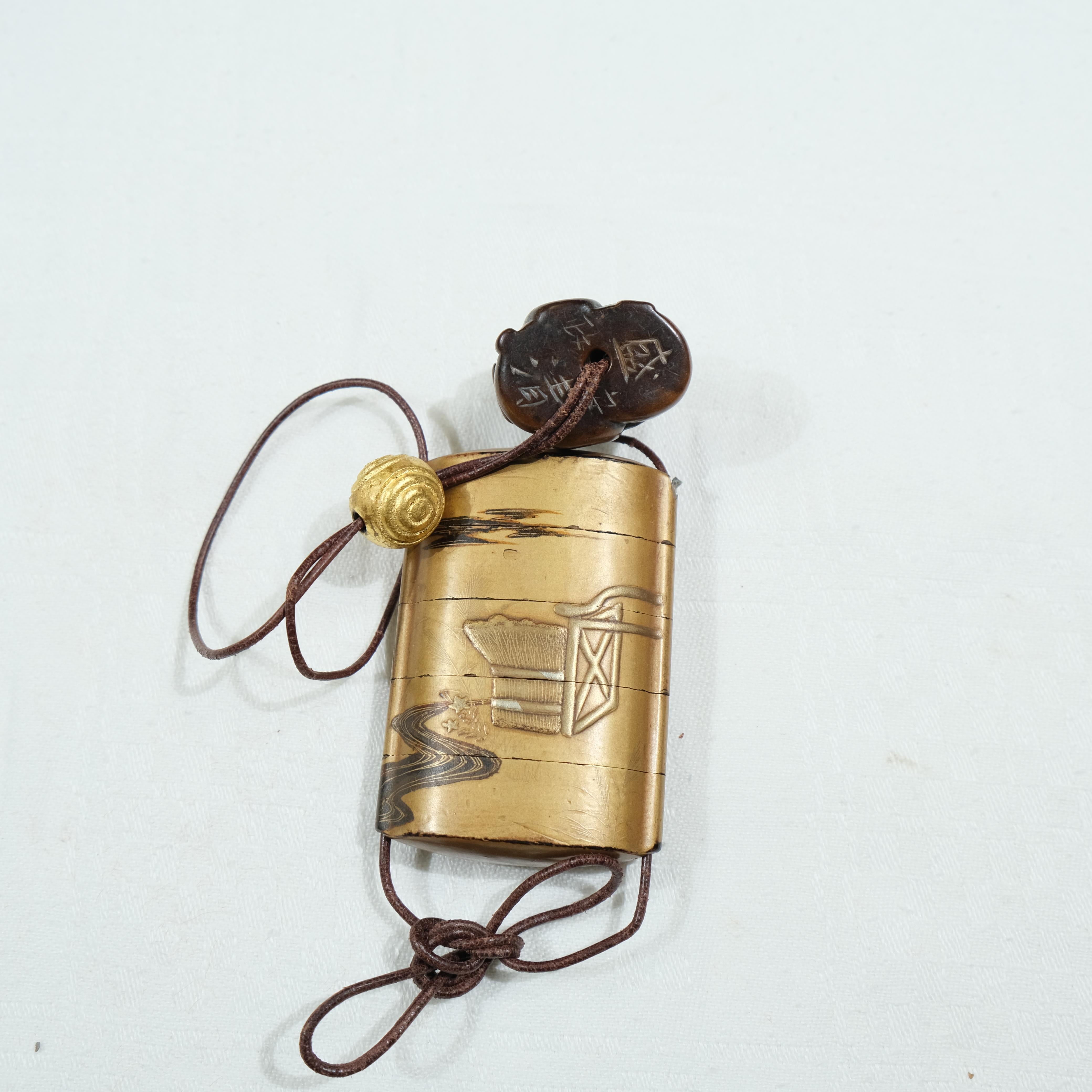 Lacquer A fivepart Japanese lacquer inro with netsuke, late 19th c. For Sale