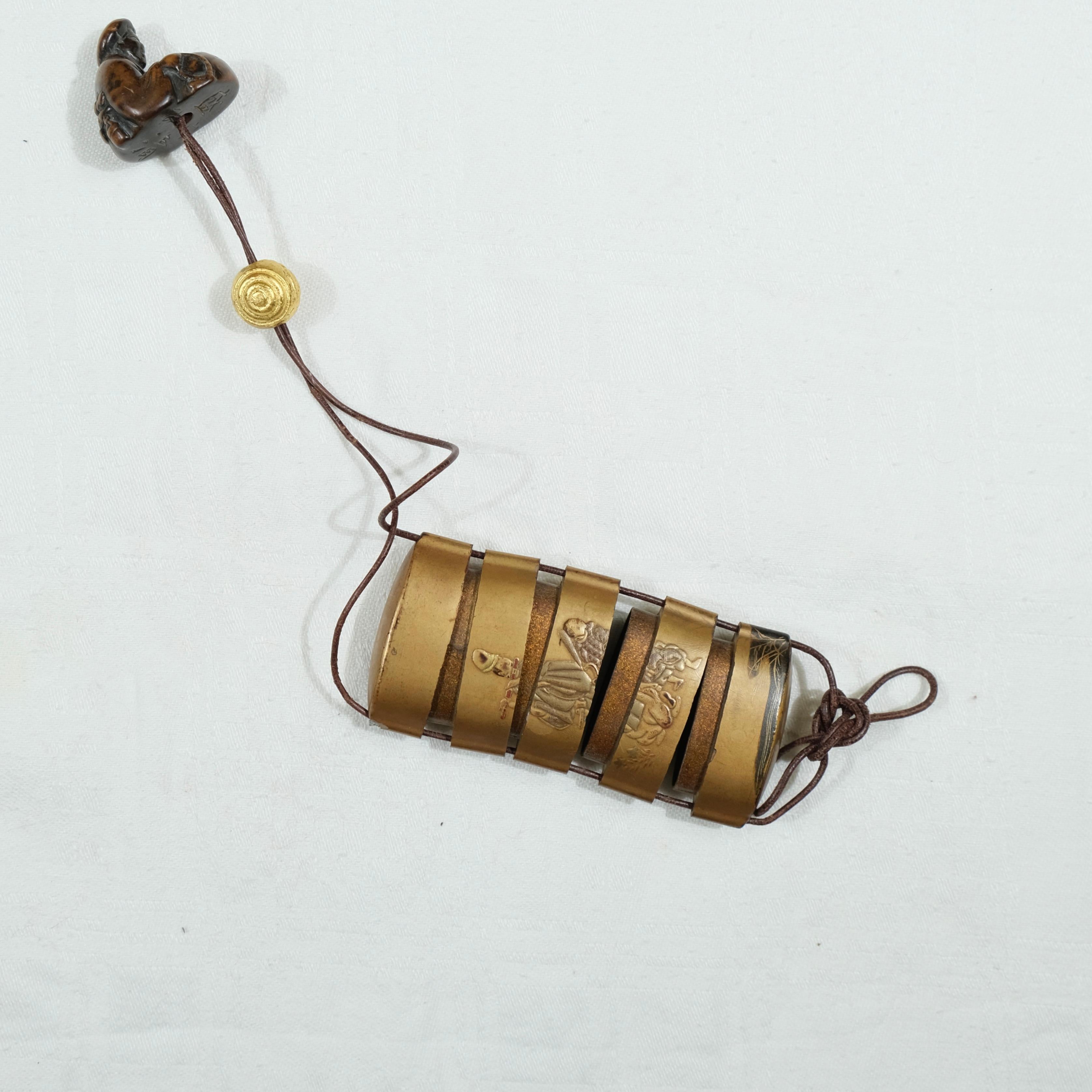 A fivepart Japanese lacquer inro with netsuke, late 19th c. For Sale 2