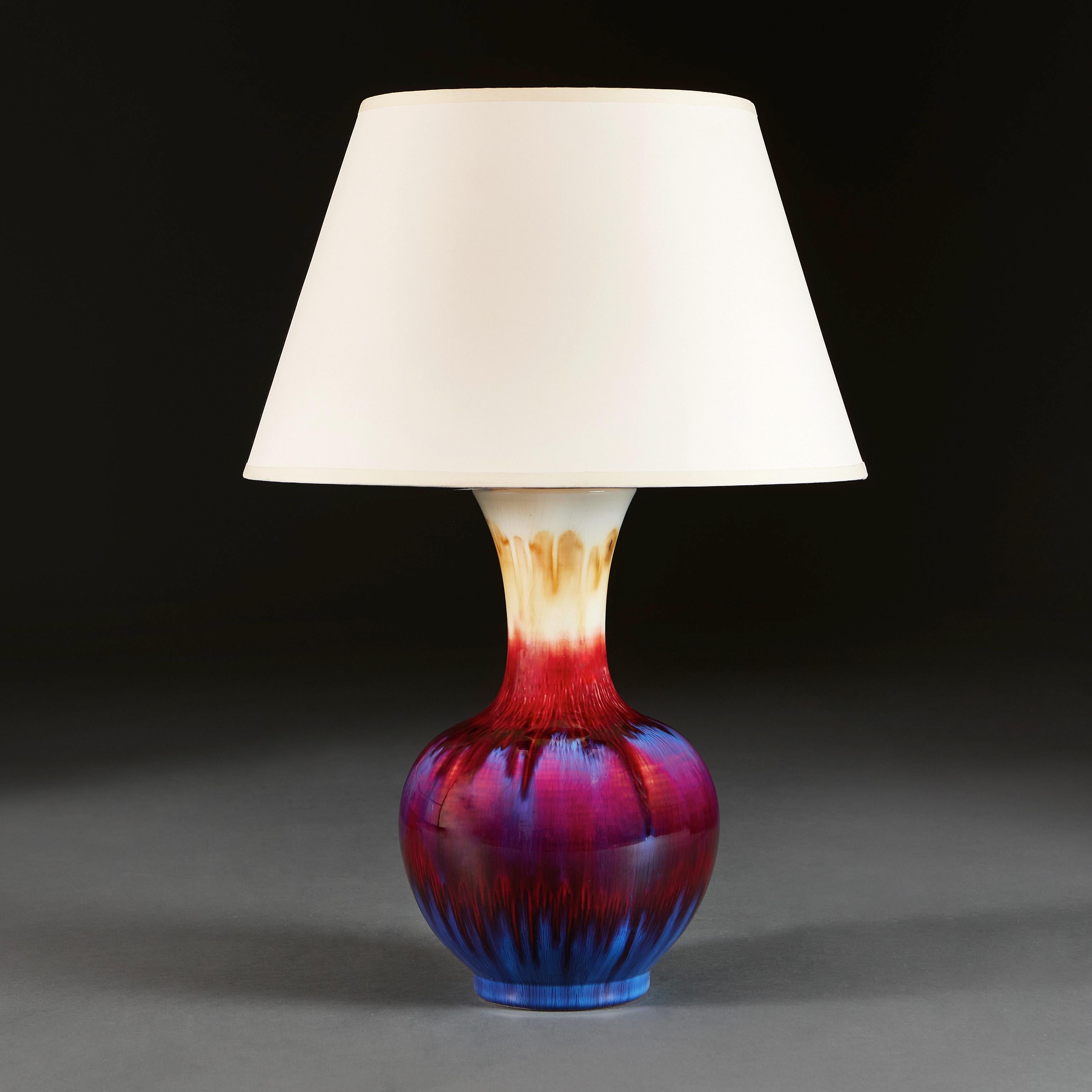 China, circa 1950.

A twentieth century bottle vase with flared neck, with strong red, blue and purple flambe glaze, now converted as a lamp.

Height 35.00cm.
Diameter 22.00cm.

Please note: This is currently wired for the UK with BC bulb