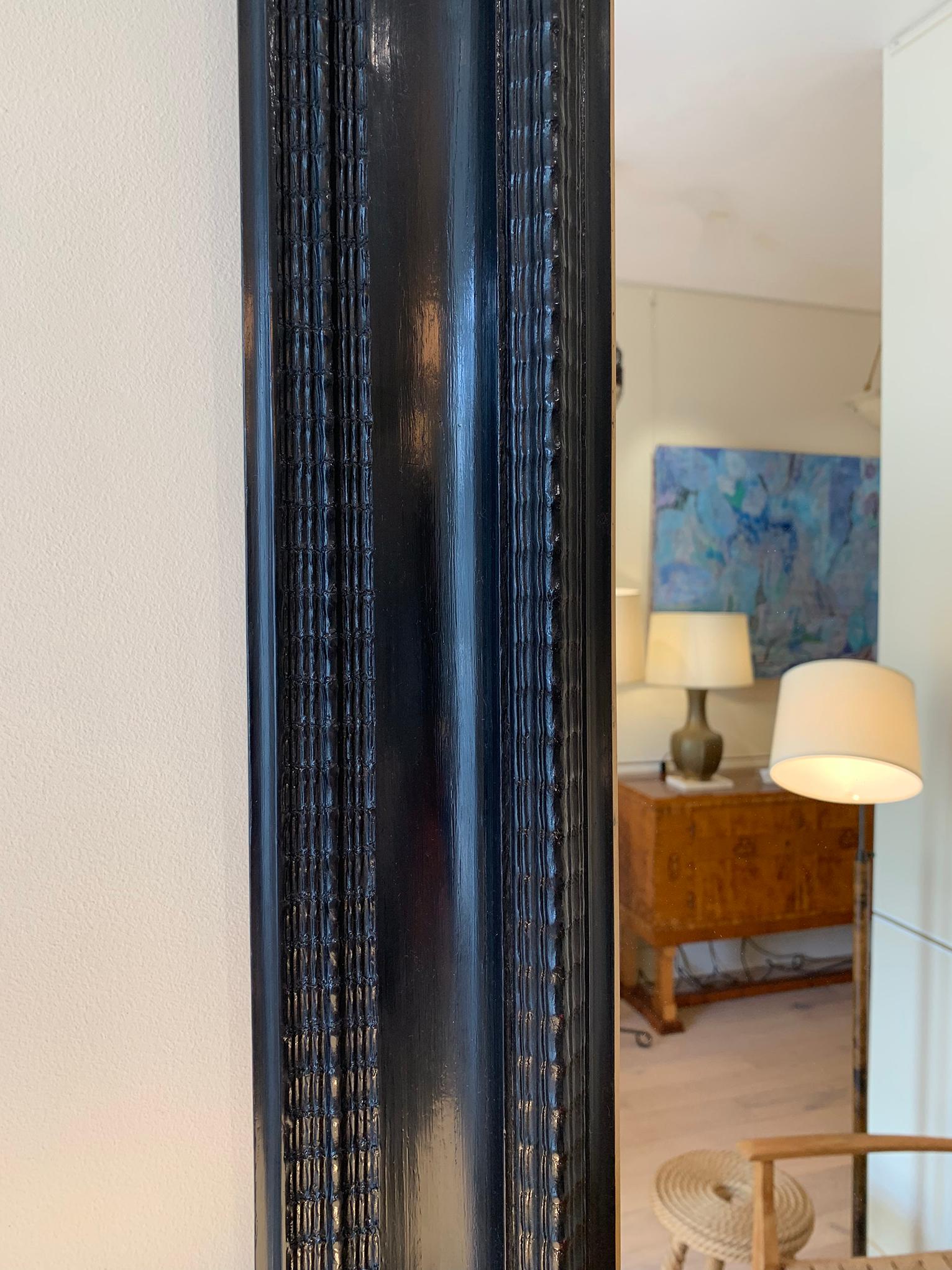 20th Century Flemish Style Ebonised Ripple Frame Mirror