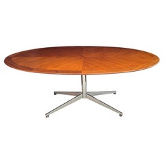 A Florence Knoll Walnut and Chrome Oval Dining Table by G.M. Proctor & Sons