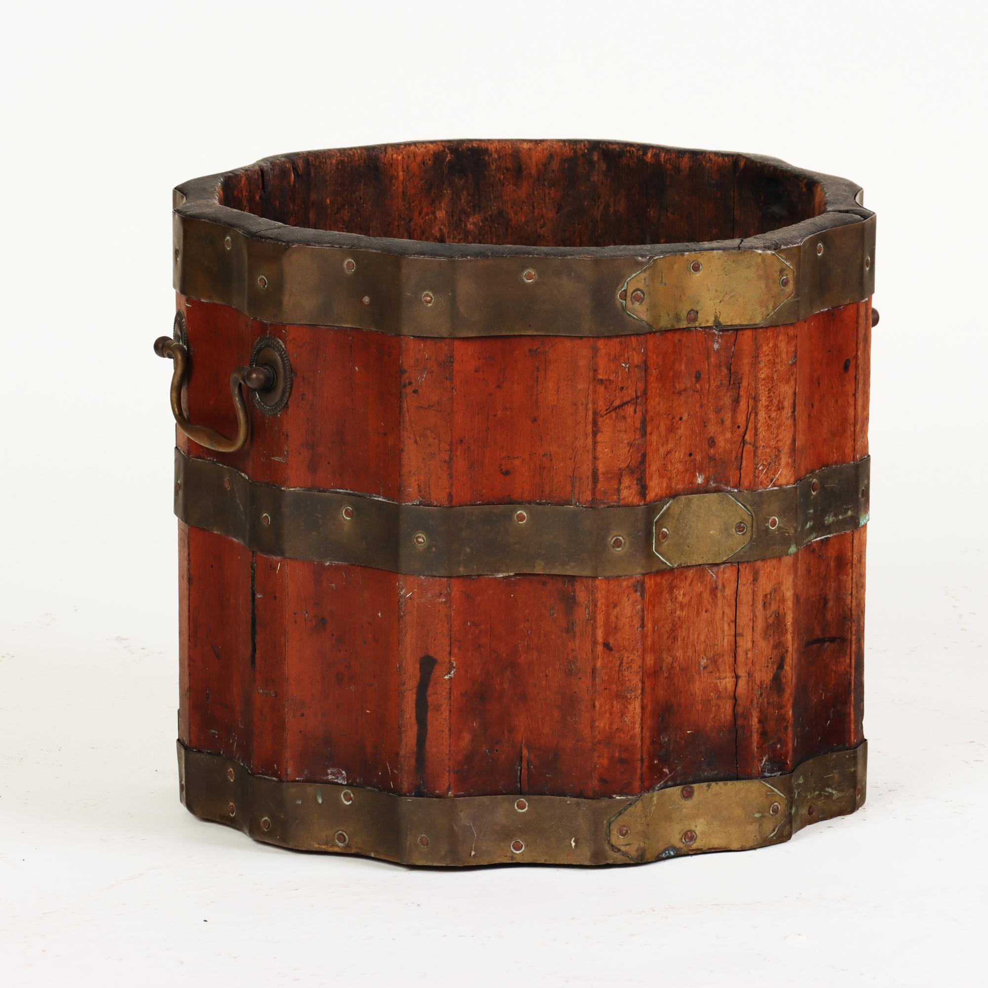 A beautiful rare fluted vintage wine barrel or bucket, with brass bands and handles, 19th C.
      