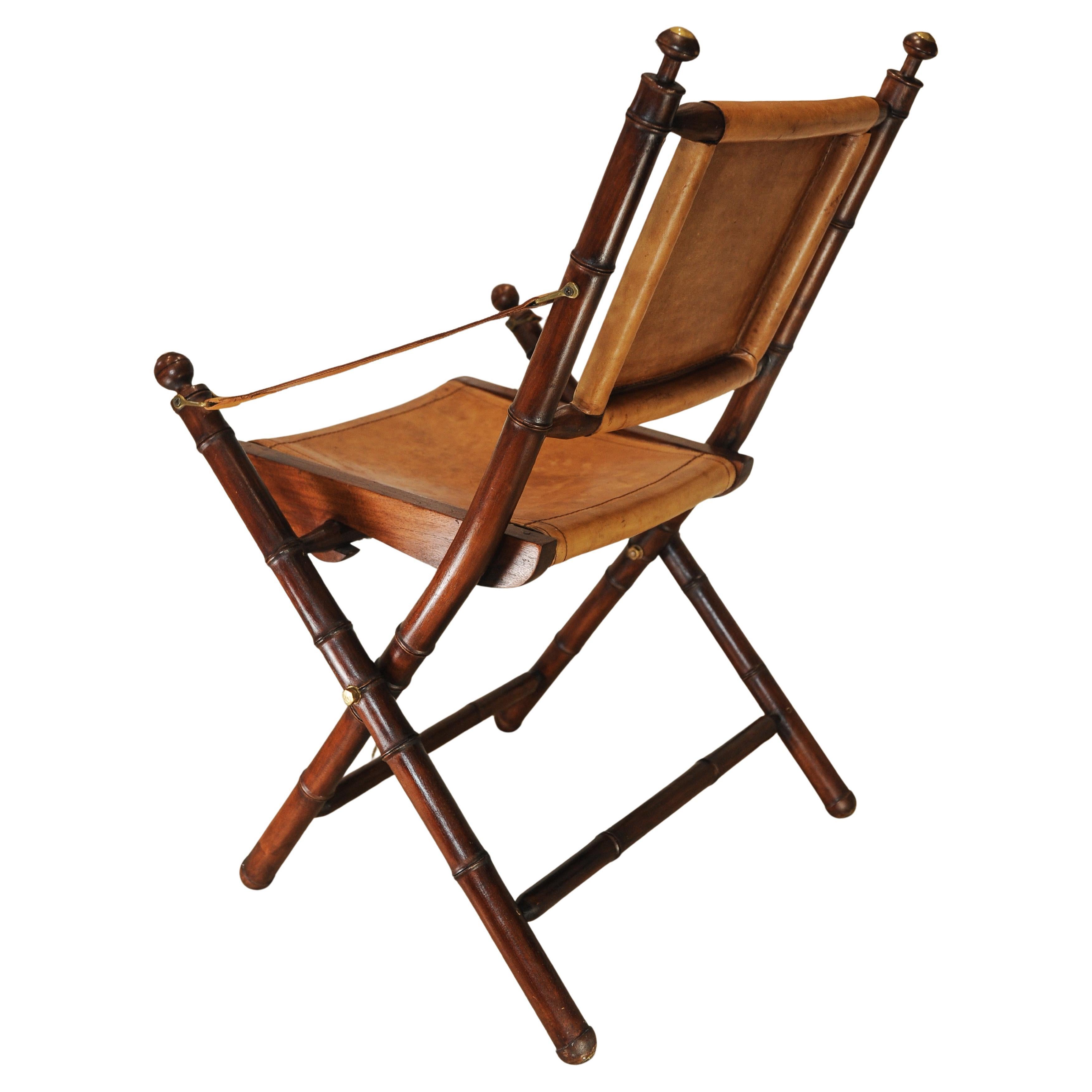 Campaign A Folding Safari Chair With Stitched Tan Leather Straps & Seat Faux Bamboo Legs For Sale