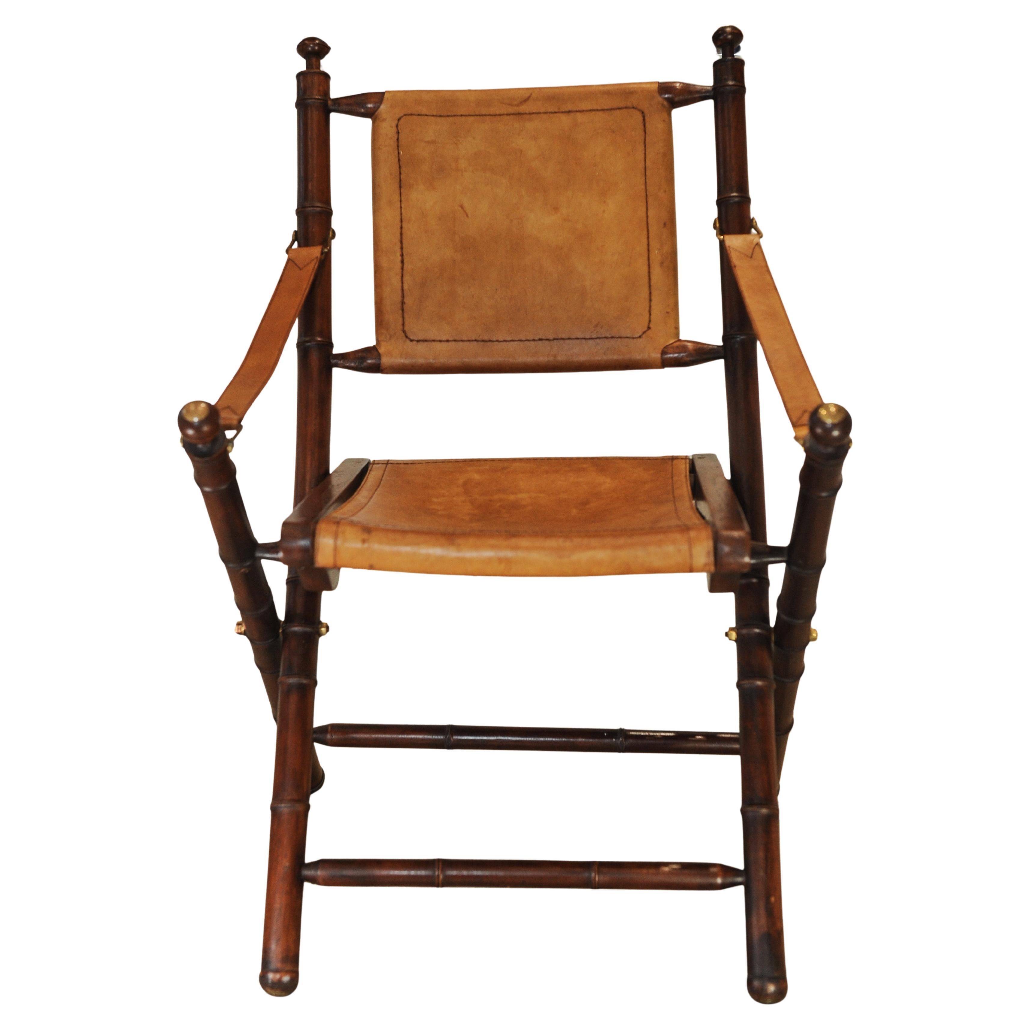 20th Century A Folding Safari Chair With Stitched Tan Leather Straps & Seat Faux Bamboo Legs For Sale